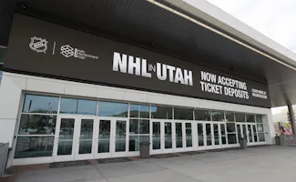 The main entrance of the Delta Center is seen with the "NHL in Utah" logos on April 19. The NHL has allowed the sale of the Arizona Coyotes and the team will relocate to Salt Lake City, Utah, and we're looking at the Utah NHL team name odds.
