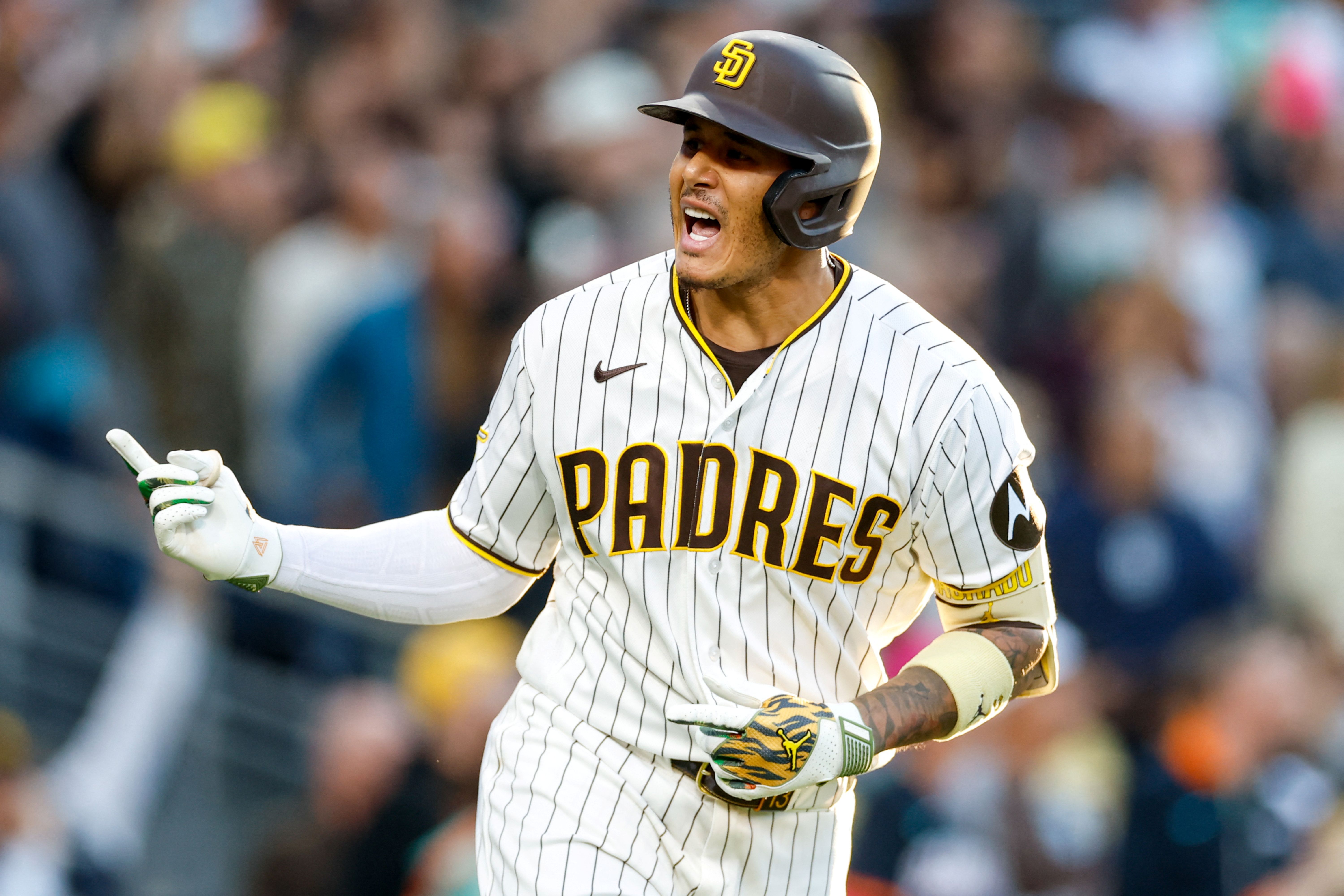 San Diego Padres third baseman Manny Machado celebrates, and he's key as we look at our home run predictions today.
