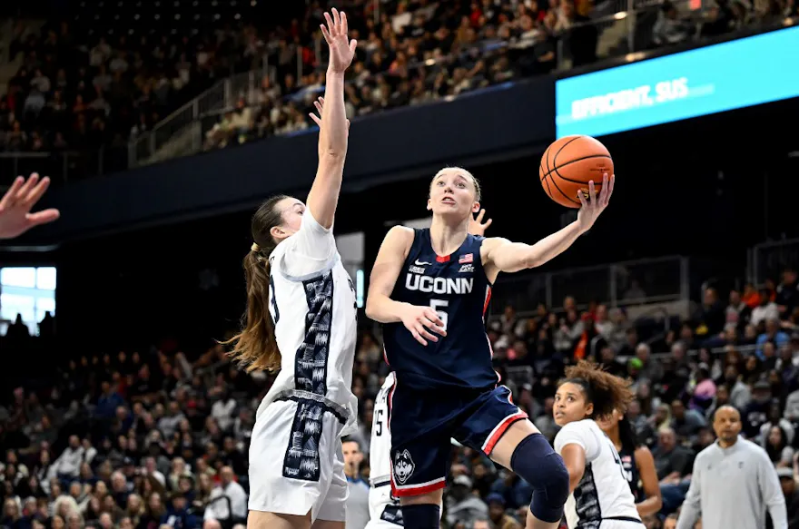 Paige Bueckers #5 of the UConn Huskies drives to the basket as we look at our UConn vs. South Carolina prediction