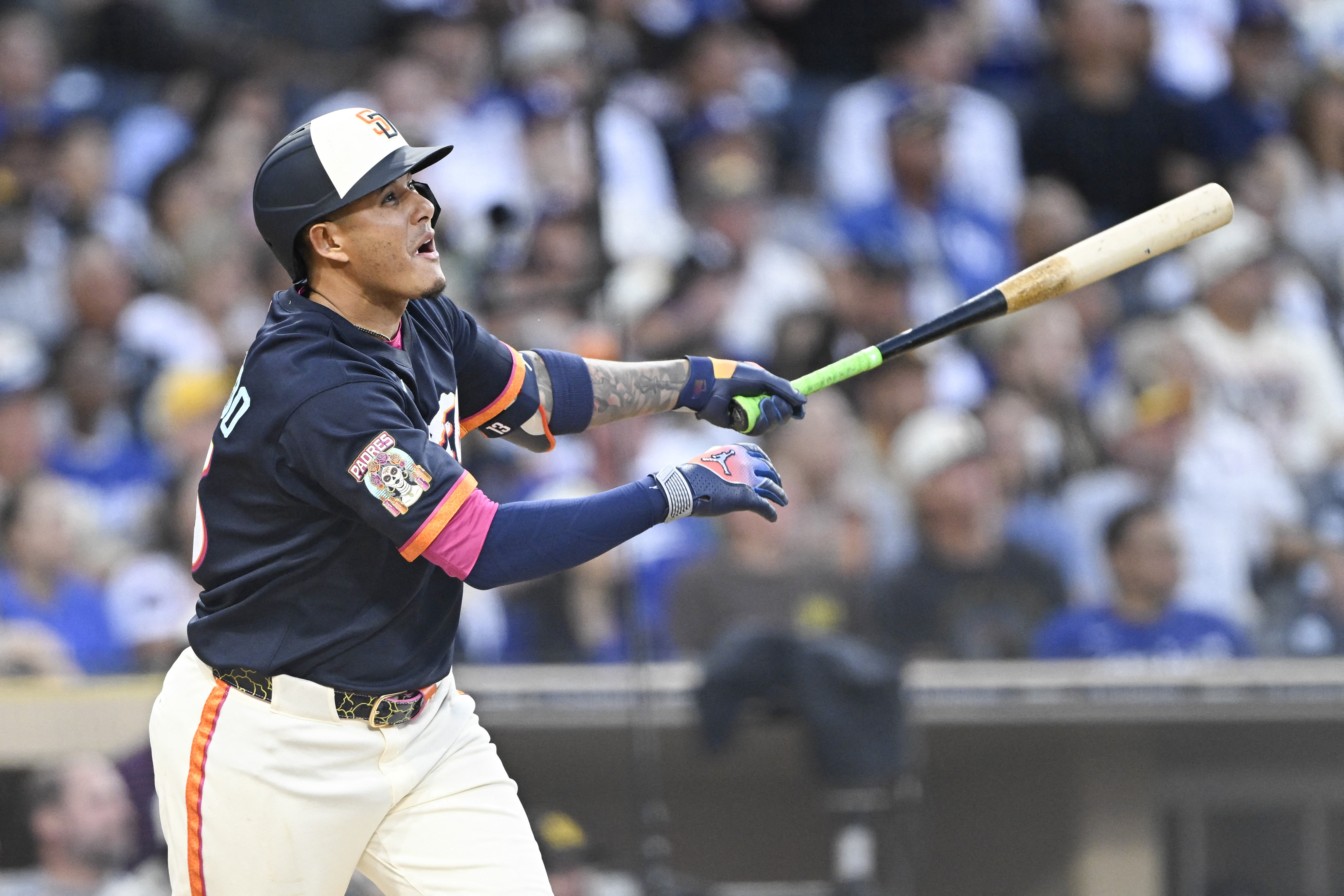 San Diego Padres third baseman Manny Machado (13) swings the bat as we break down the Dodgers vs. Padres win probability.