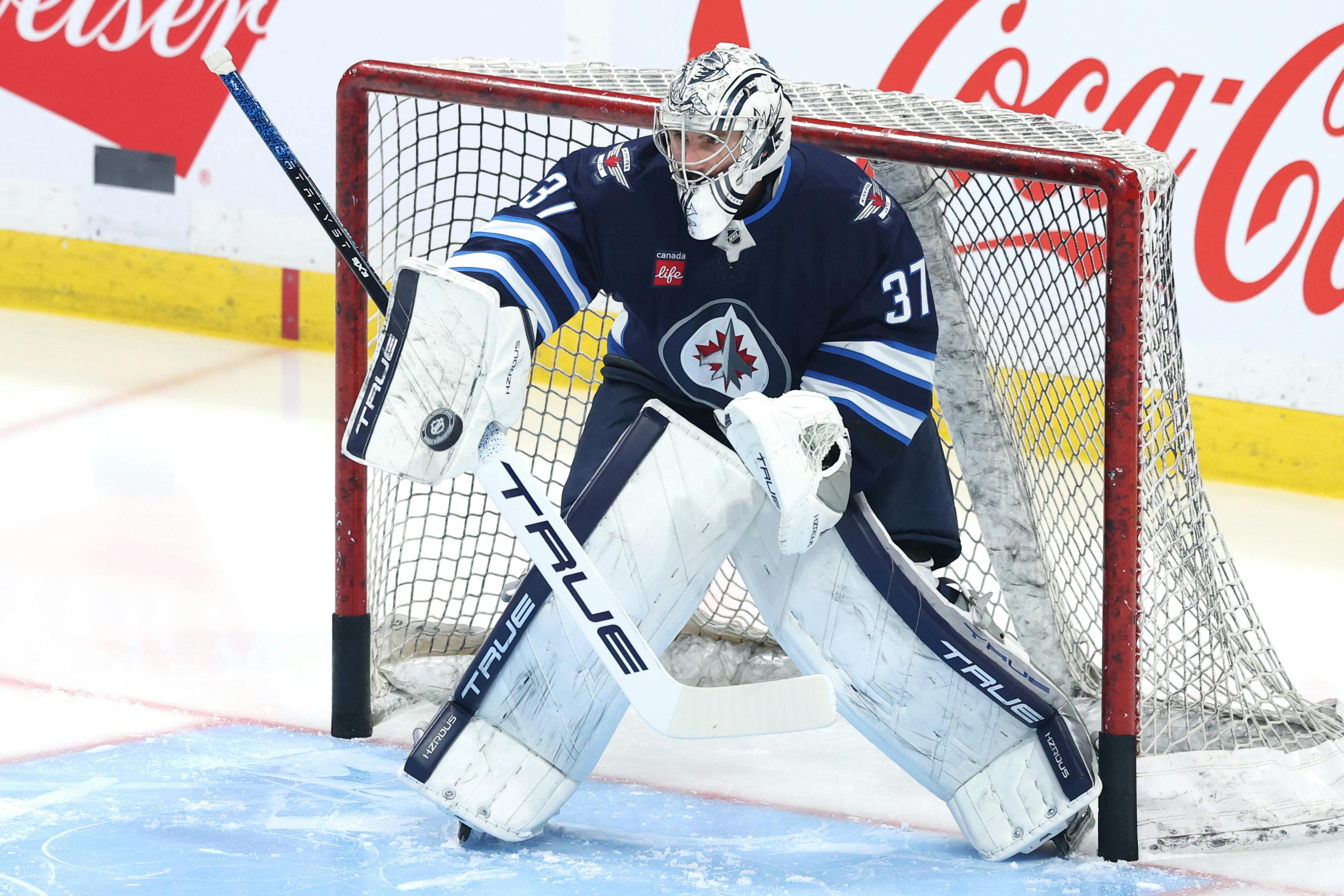 Winnipeg Jets goaltender Connor Hellebuyck warms up before a game against the Anaheim Ducks as we break down the Vezina Trophy odds. 