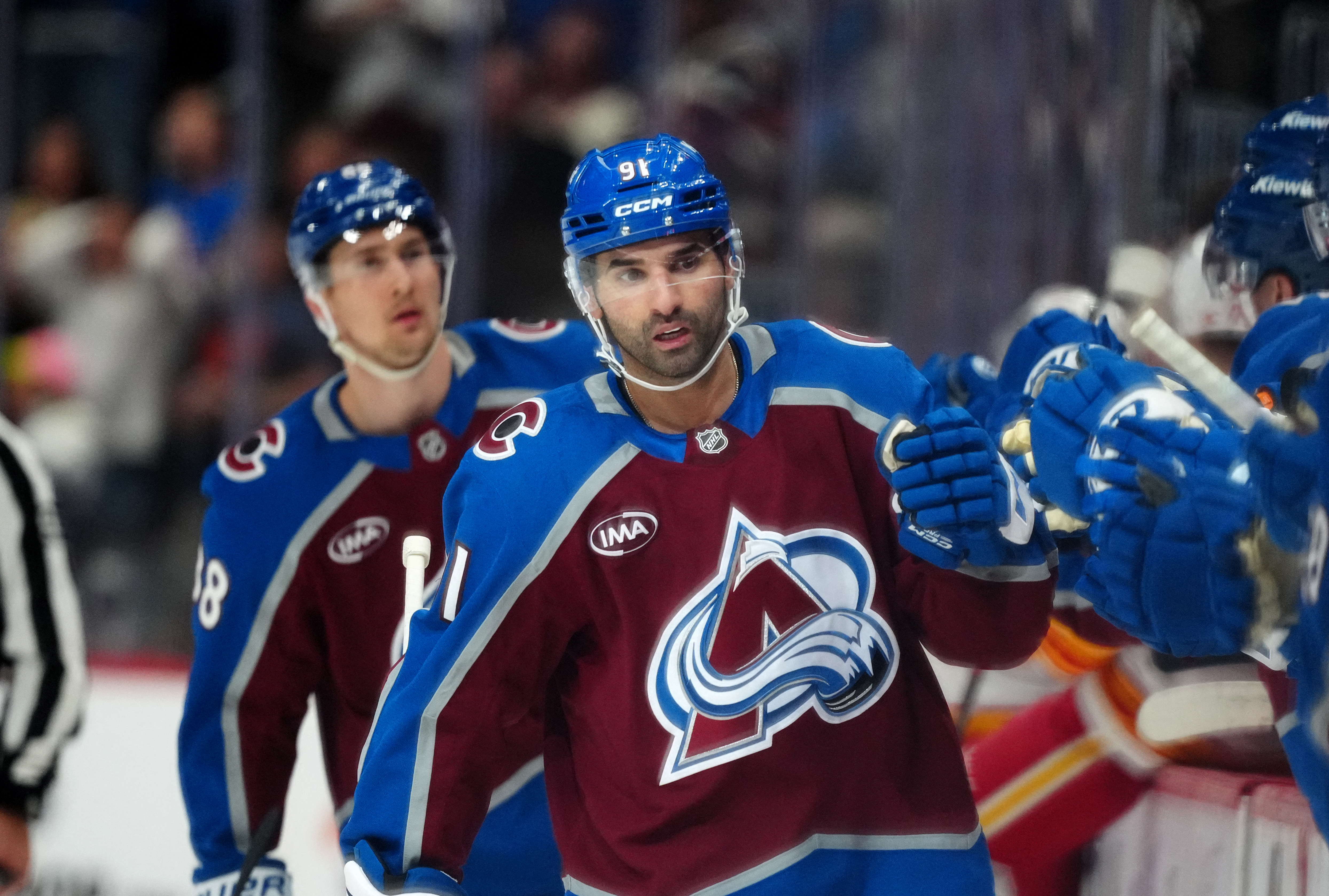 Colorado Avalanche center Nazem Kadri (91), seen here celebrating during a game, is featured in our NHL player props tonight.