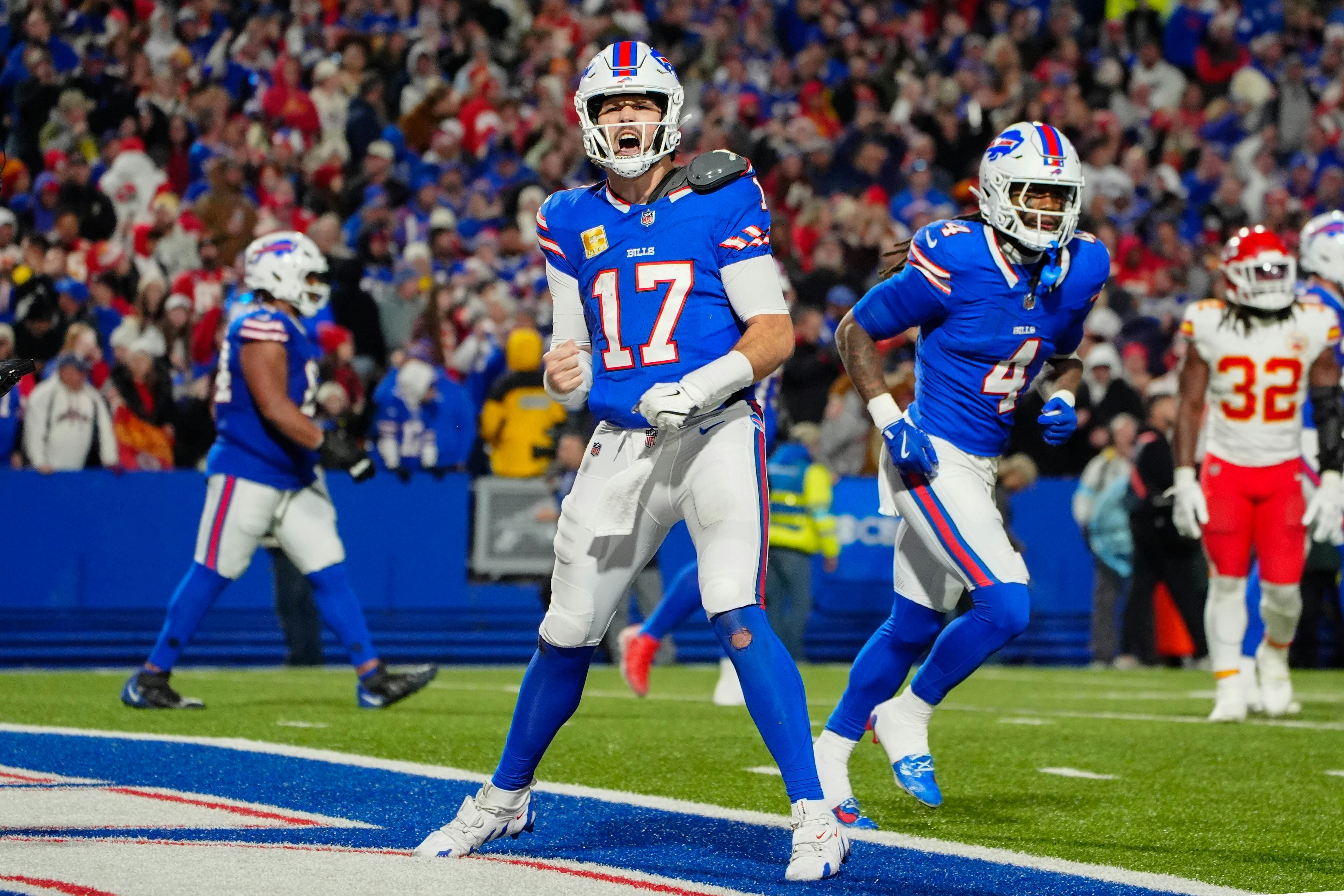 Buffalo Bills quarterback Josh Allen reacts as we offer our NFL playoff bracket predictions with picks and projected scores for every game.