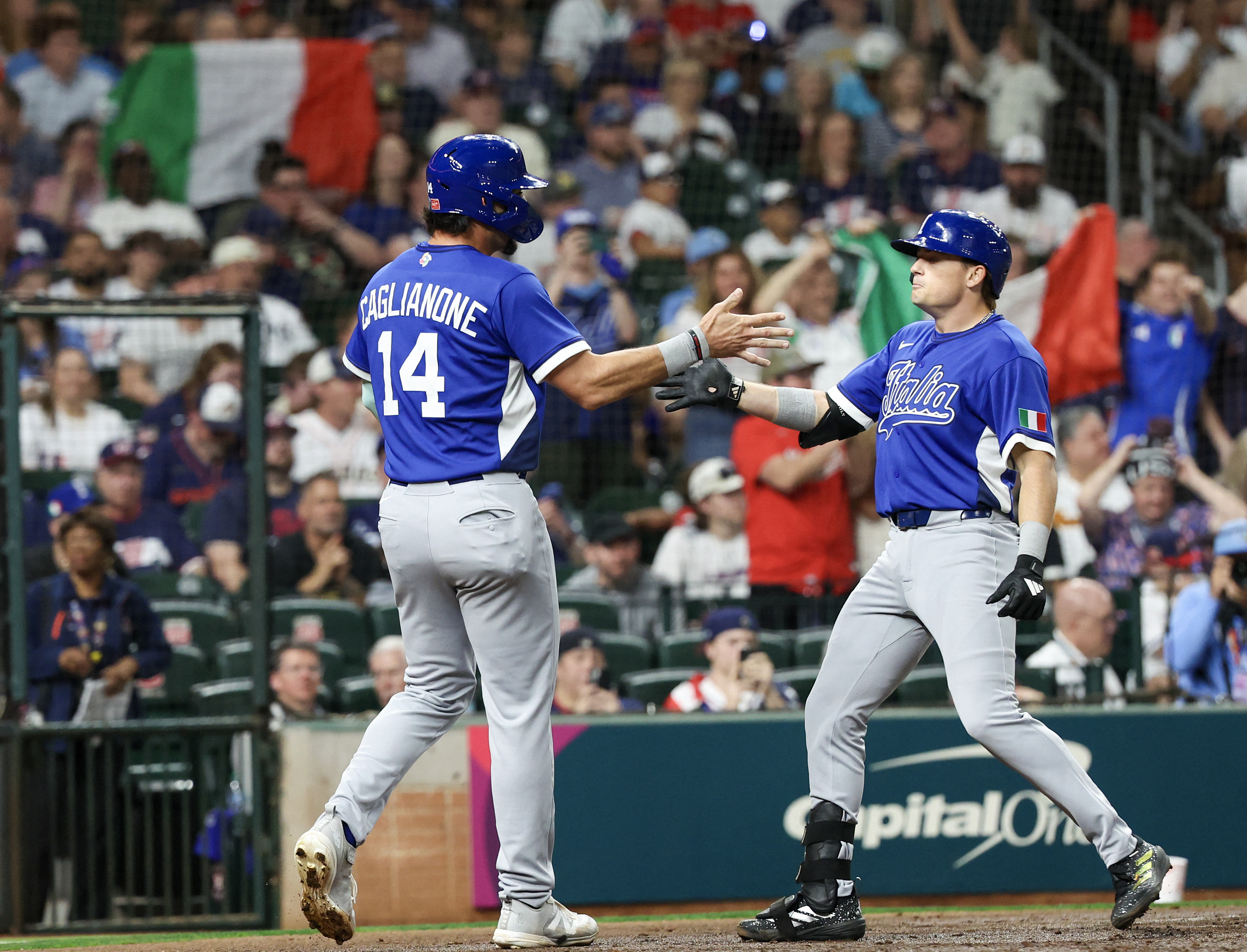 Italy right fielder Jac Caglianone (14) celebrates Italy shortstop Sam Antonacci (10) two-run home run.