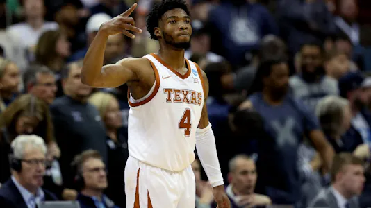 Tyrese Hunter of the Texas Longhorns reacts after scoring against the Xavier Musketeers during the first half in the Sweet 16 round.