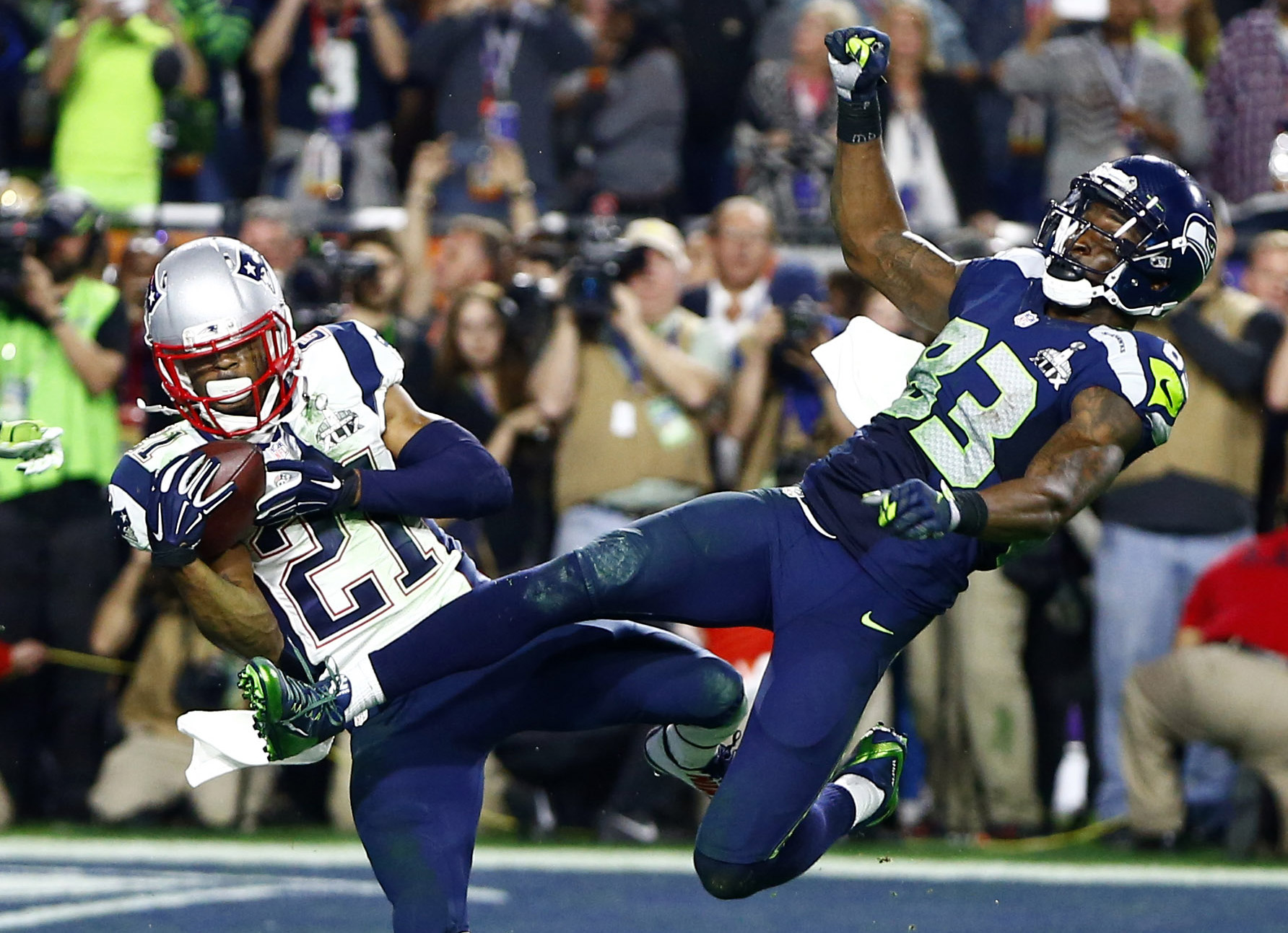 New England Patriots strong safety Malcolm Butler (21) intercepts a pass intended for Seattle Seahawks wide receiver Ricardo Lockette (83) in the fourth quarter in the Super Bowl. 