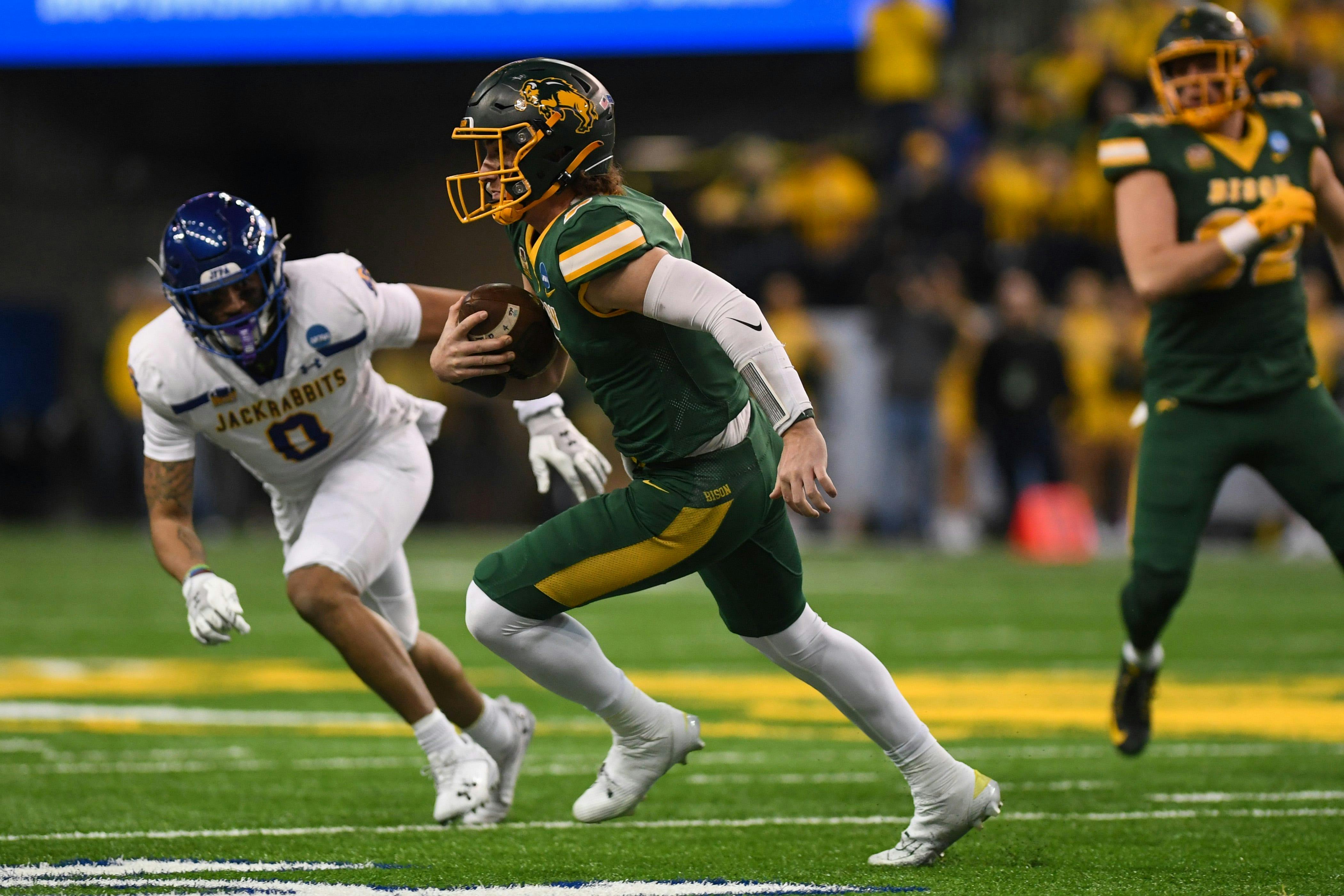 North Dakota State QB Cam Miller runs against South Dakota State. The Bison are underdogs by the FCS championship odds.