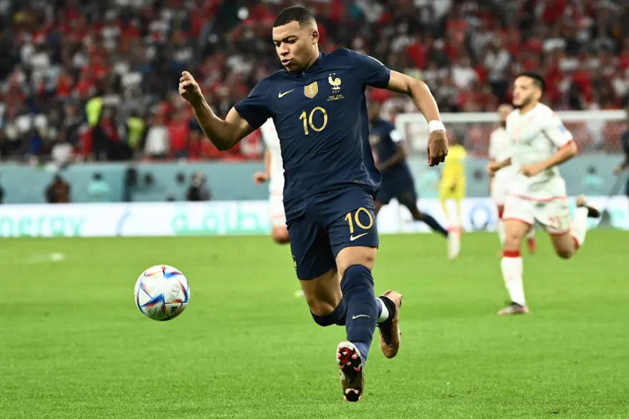 French forward Kylian Mbappe runs with the ball during the Qatar 2022 World Cup Group D soccer match between Tunisia and France on Nov. 30, 2022 at Education City Stadium in Al-Rayyan, Qatar. 