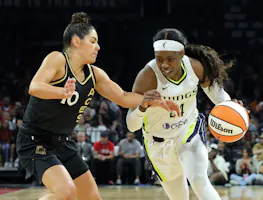 Arike Ogunbowale (24) of the Dallas Wings drives against Kelsey Plum (10) of the Las Vegas Aces, as we offer our best Aces vs. Wings prediction and expert picks for Wednesday's WNBA matchup at College Park Center in Arlington, Texas.
