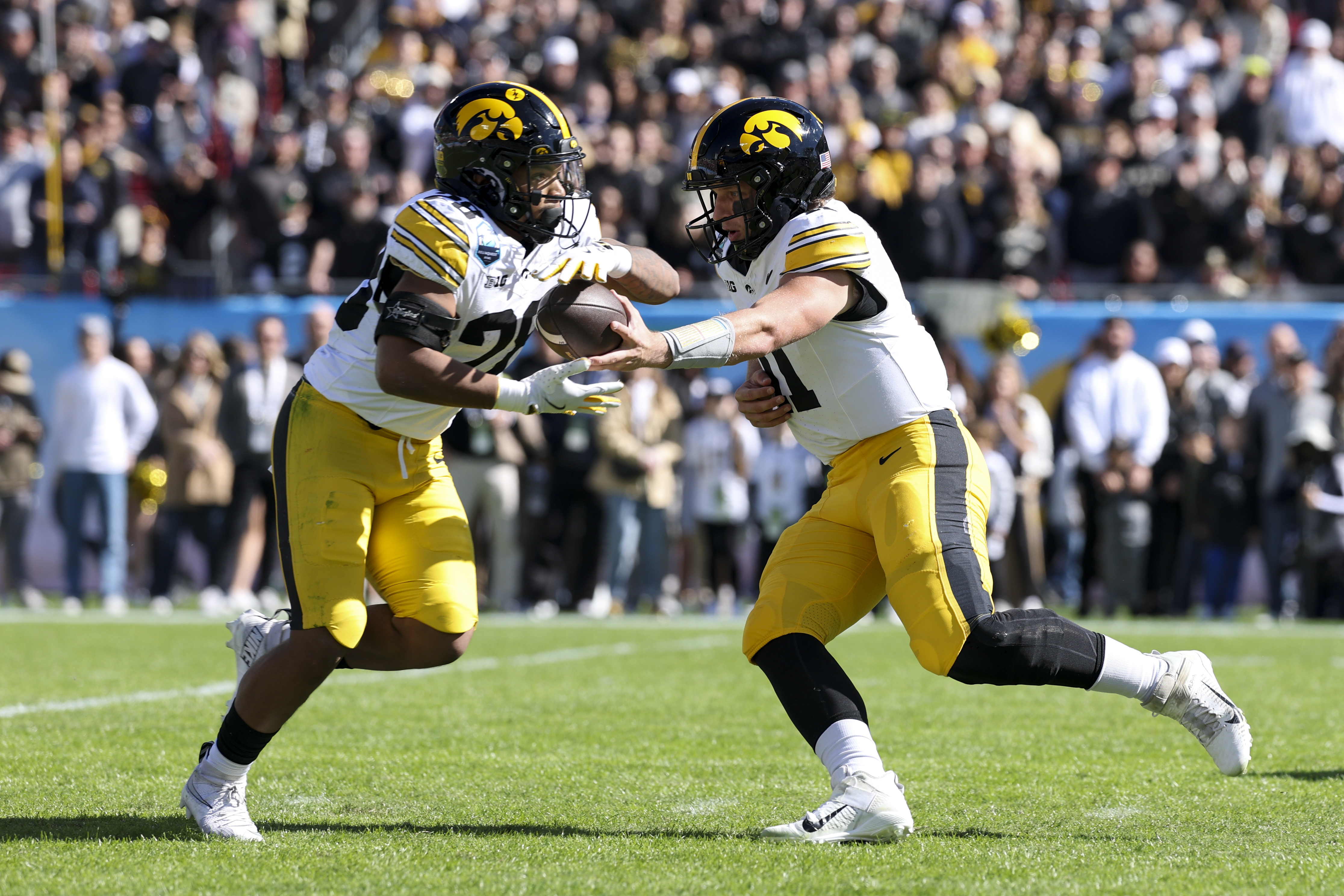 Iowa Hawkeyes running back Kamari Moulton (28) runs as he is featured in our Iowa State vs. Iowa prediction.