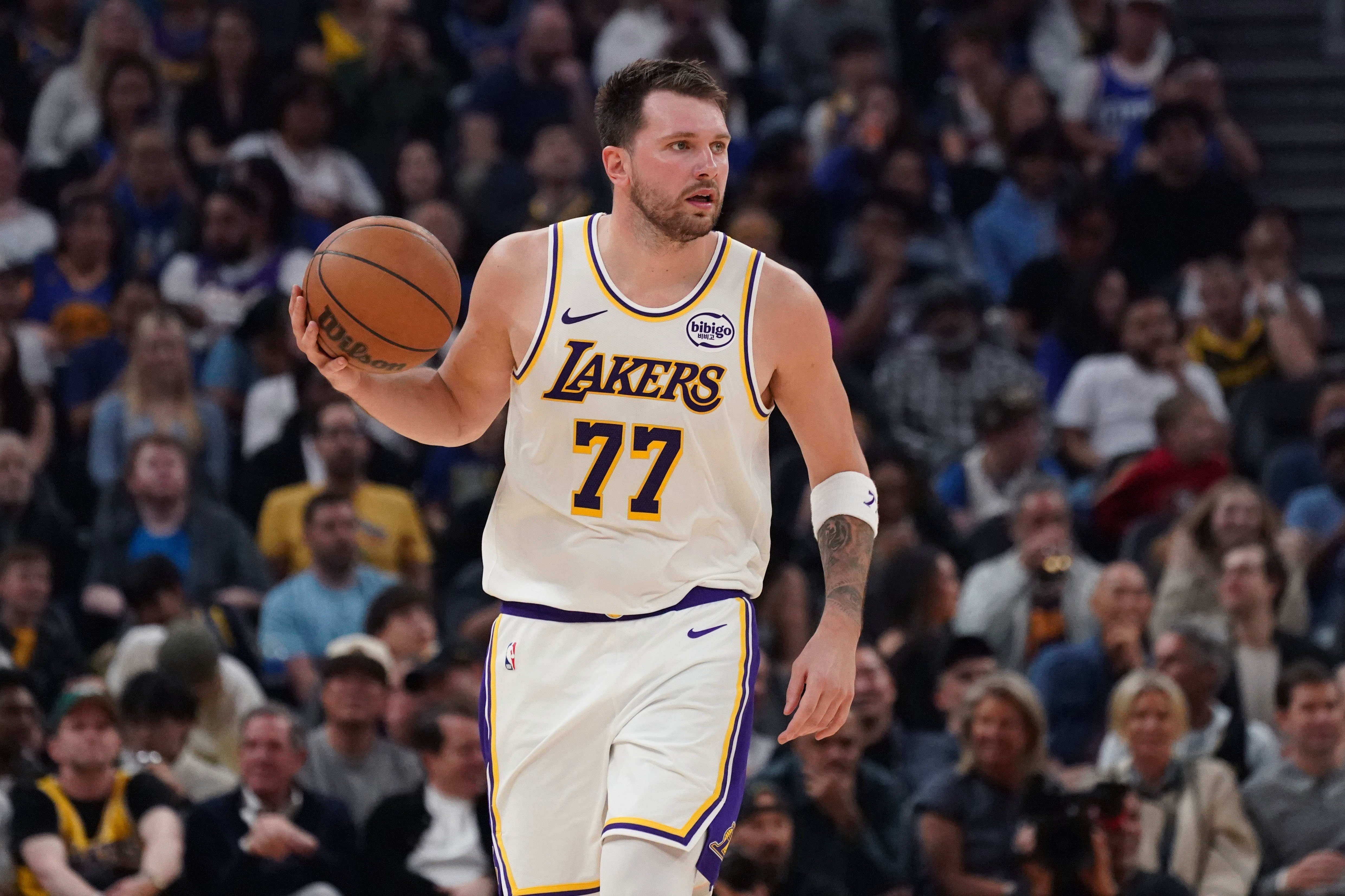 Los Angeles Lakers guard Luka Doncic (77) dribbles upcourt as we provide our NBA player props today.