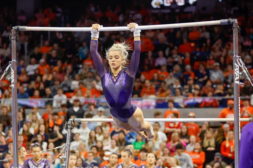 Olivia Dunne of LSU warms up on the uneven bars during a gymnastics meet against Auburn at Neville Arena on February 10, 2023 in Auburn, Alabama as we look at the Louisana legal sports betting report.