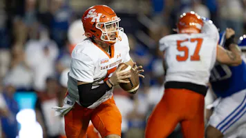 Keegan Shoemaker of the Sam Houston Bearkats runs out of the pocket against the Brigham Young Cougars during the second half of their game as we look at our Jacksonville State-Sam Houston prediction.