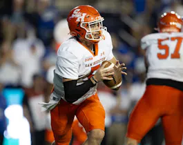 Keegan Shoemaker of the Sam Houston Bearkats runs out of the pocket against the Brigham Young Cougars during the second half of their game as we look at our Jacksonville State-Sam Houston prediction.