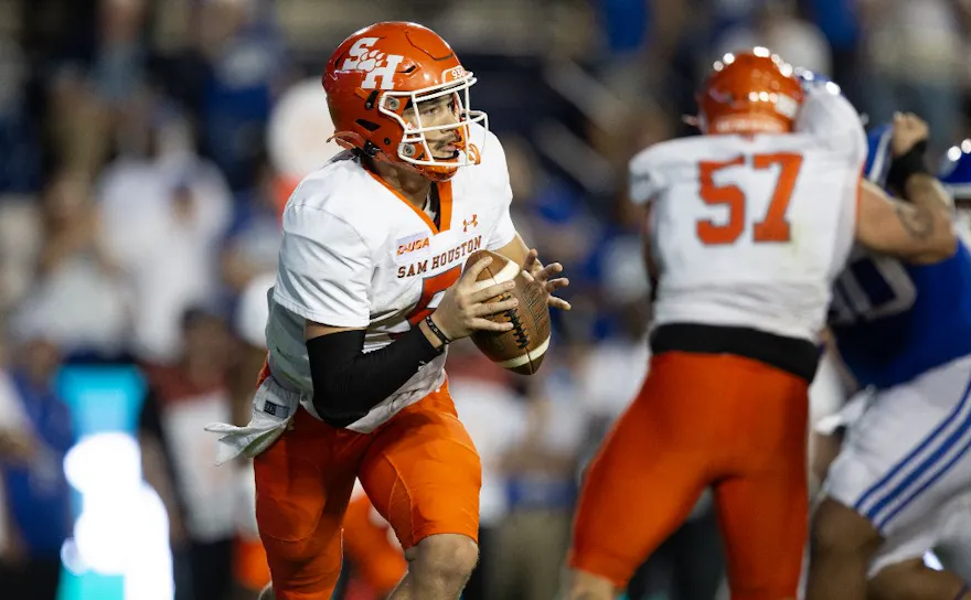 Keegan Shoemaker of the Sam Houston Bearkats runs out of the pocket as we look at our Sam Houston vs. New Mexico State prediction.
