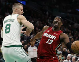 Bam Adebayo of the Miami Heat looks to go past Kristaps Porzingis of the Boston Celtics during the first quarter of Game 1, and we're offering our top Celtics vs. Heat player props and expert picks based on the best NBA odds.