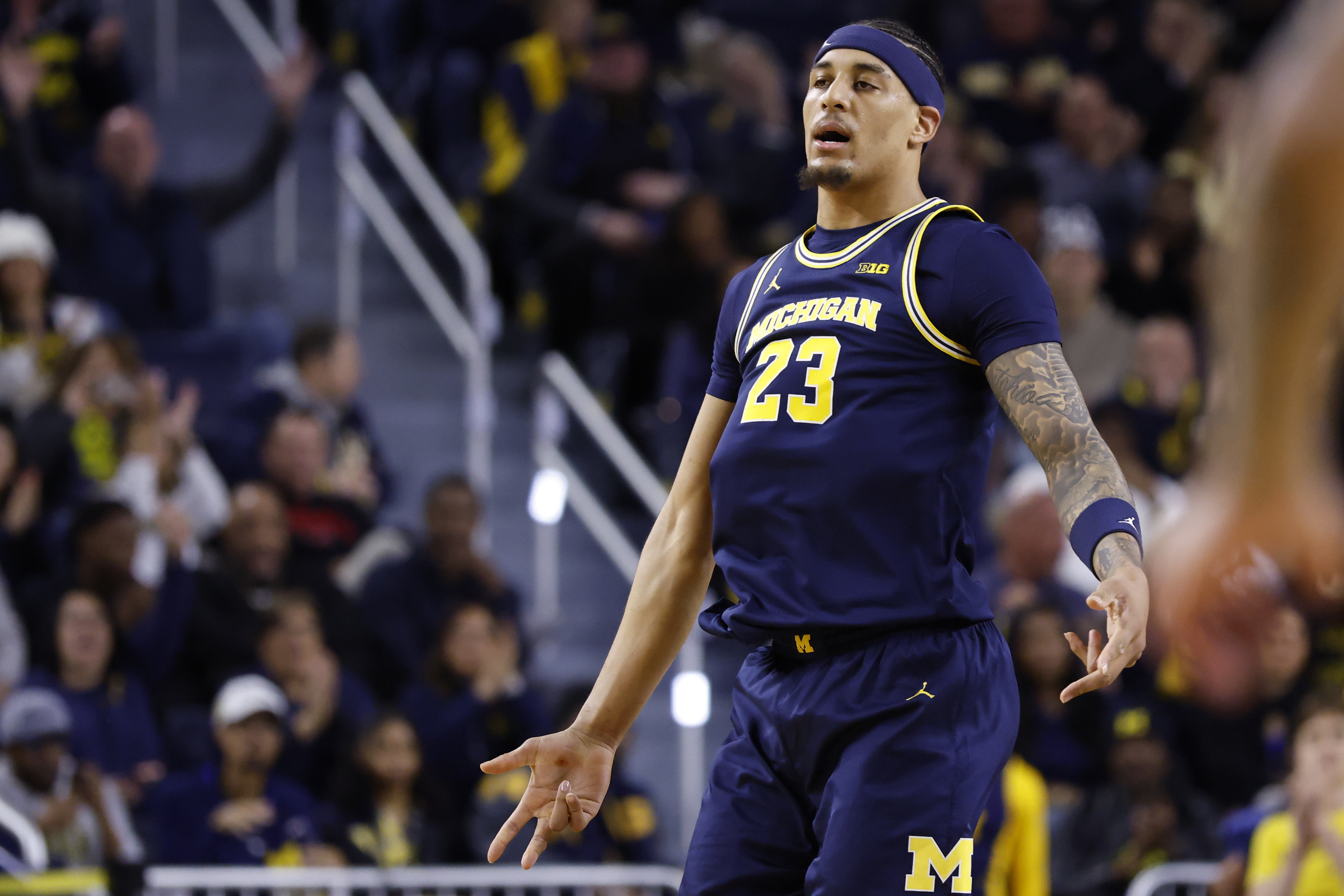 Michigan Wolverines forward Yaxel Lendeborg (23) celebrates a three point basket as we break down our college basketball Play of the Day.