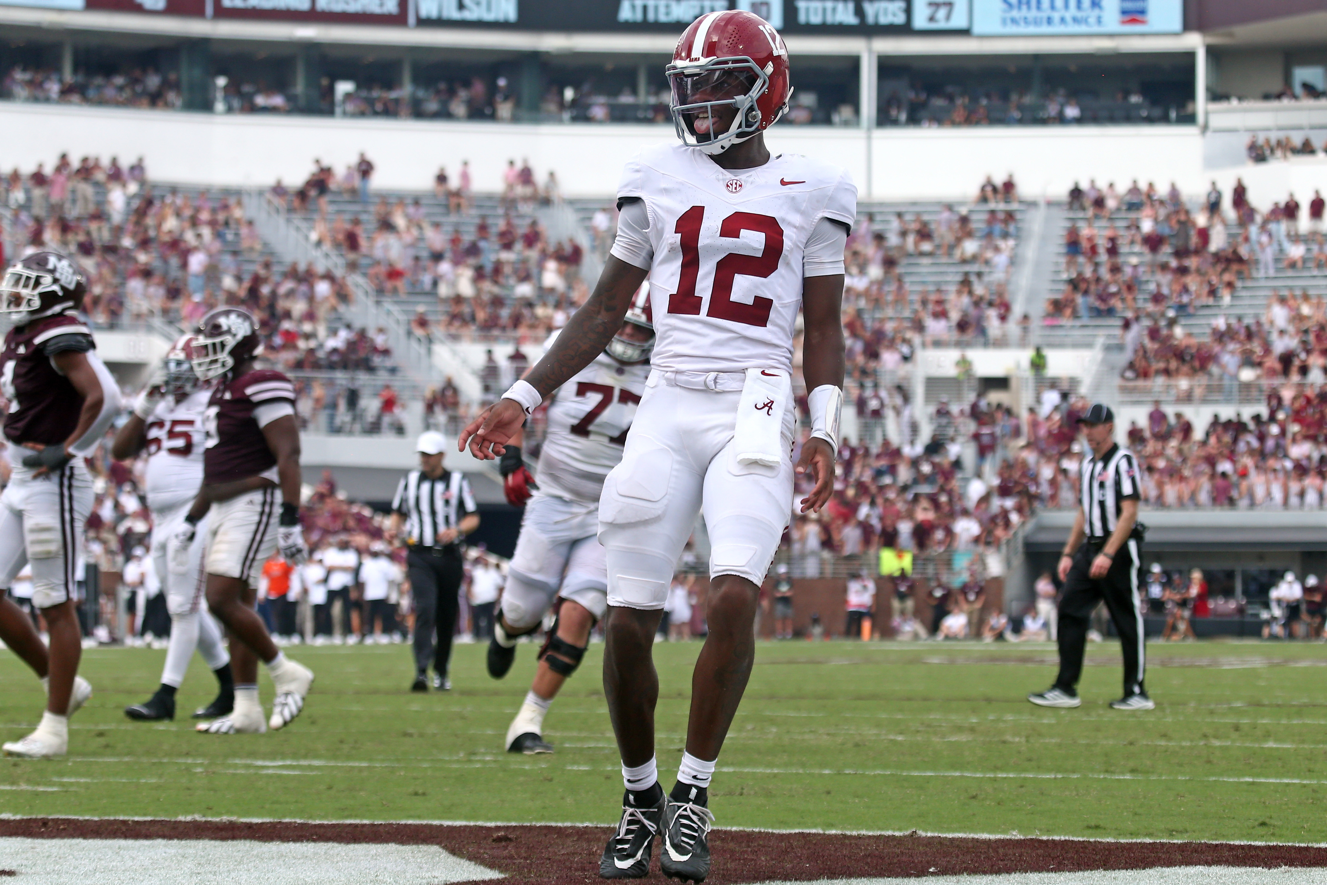 Alabama Crimson Tide quarterback Keelon Russell (12) reacts after a touchdown as he is featured in our Georgia vs. Alabama touchdown pick.