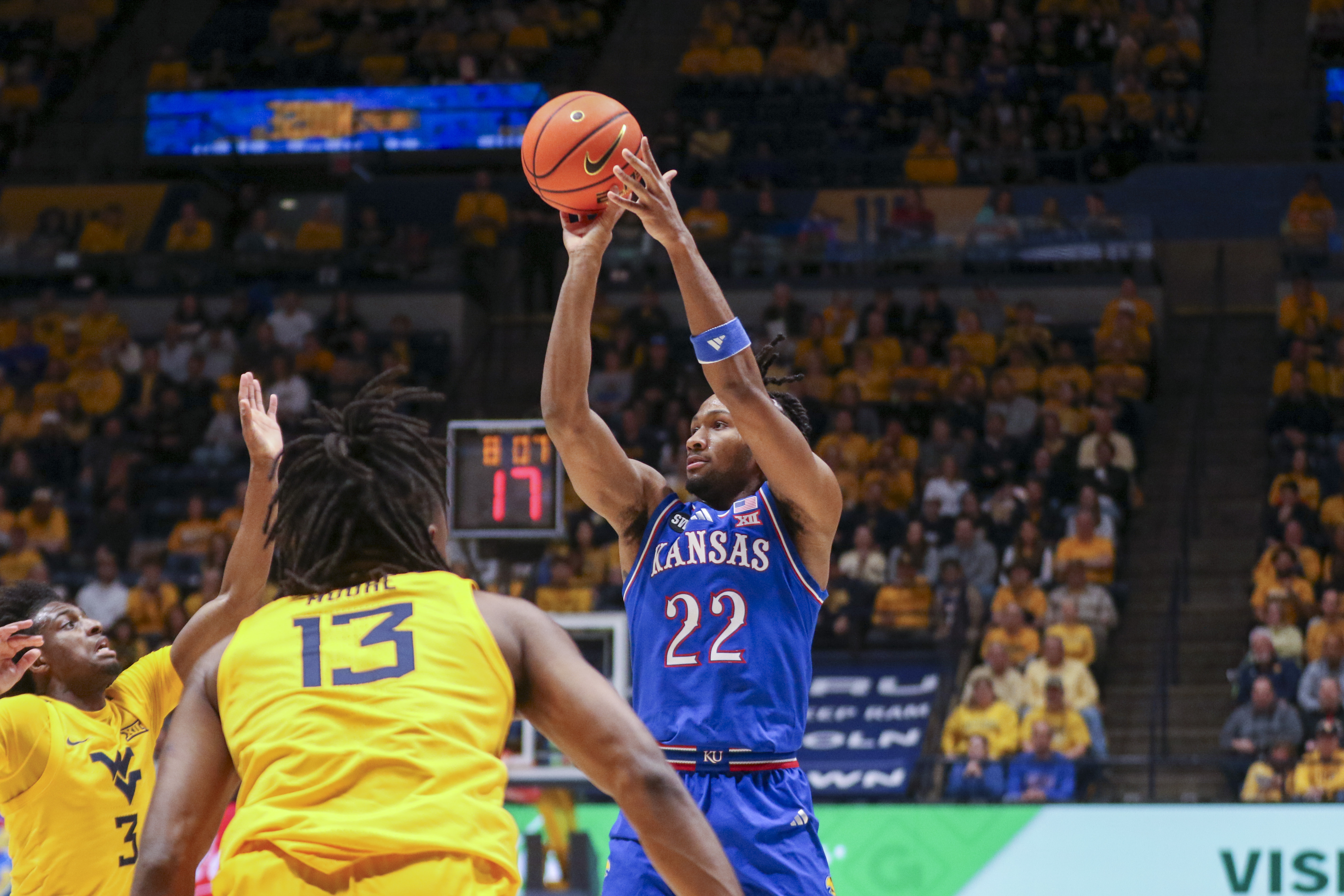 Kansas guard Darryn Peterson (22) is key to our college basketball predictions tonight. 