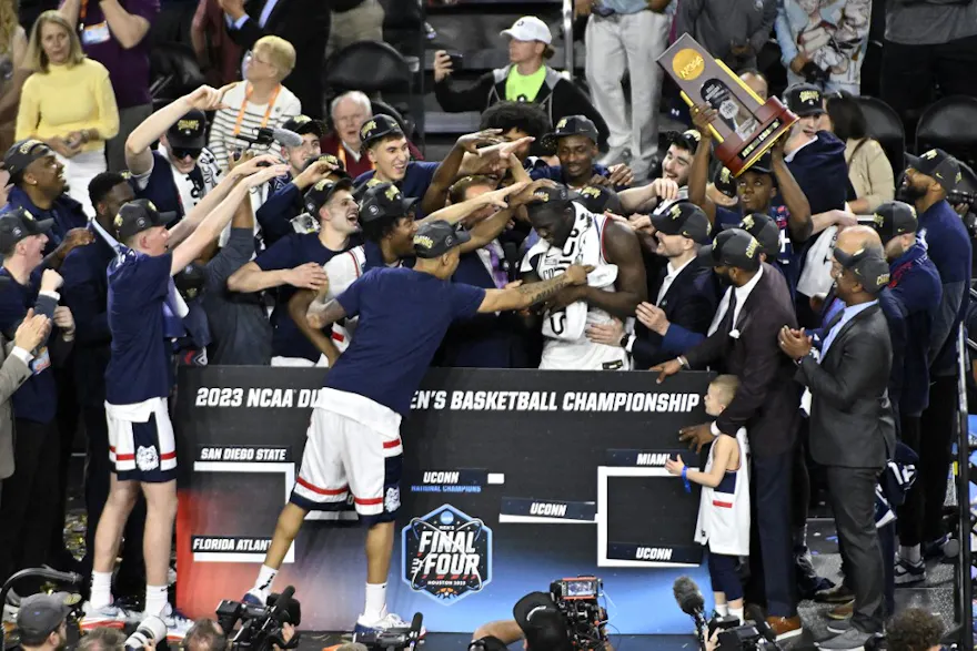 Adama Sanogo of the Connecticut Huskies celebrates with teammates after being named the tournament's Most Outstanding Player at NRG Stadium in Houston, Texas. Photo by Logan Riely/Getty Images via AFP.