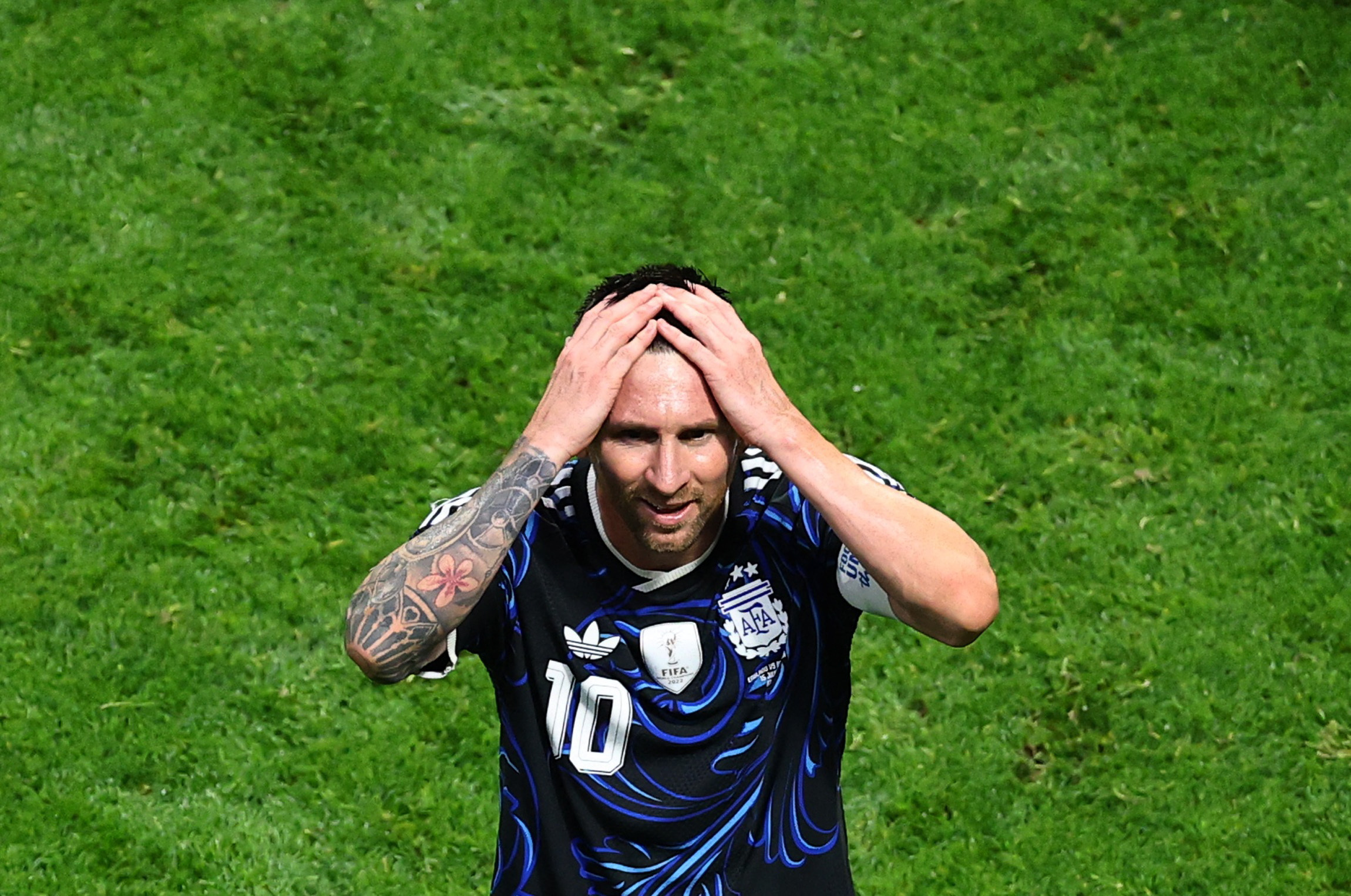 Argentina's Lionel Messi celebrates after the match as he is featured in our Spain vs. Argentina World Cup first goal scorer predictions.