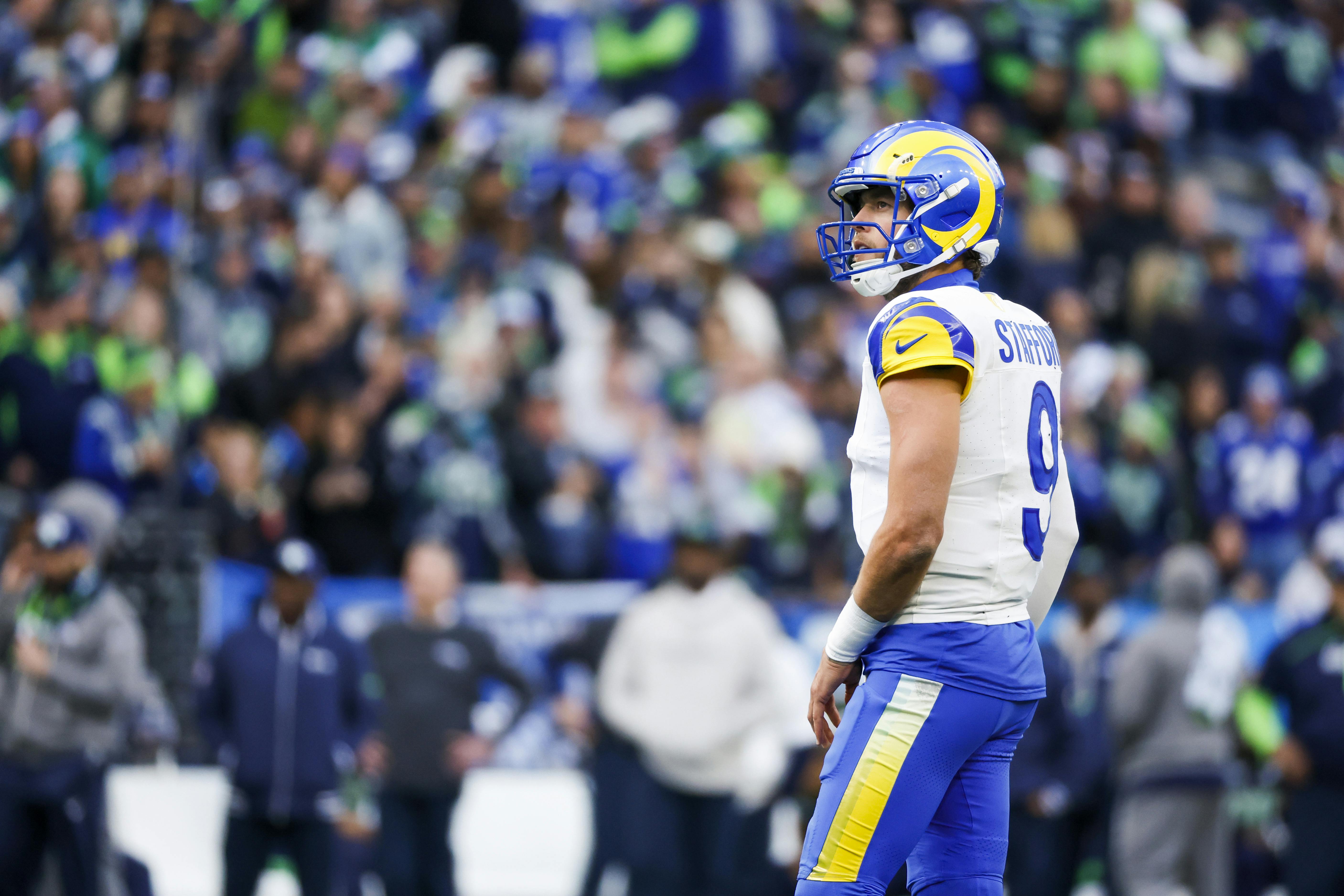 Los Angeles Rams quarterback Matthew Stafford waits for a timeout as we offer our NFL Week 12 odds and predictions.