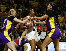 Naz Hillmon (0) of the Atlanta Dream controls the ball against Cameron Brink (22) and Dearica Hamby (5) of the Los Angeles Sparks, as we offer our Sparks vs. Aces odds and expert picks for Saturday's ABC doubleheader.