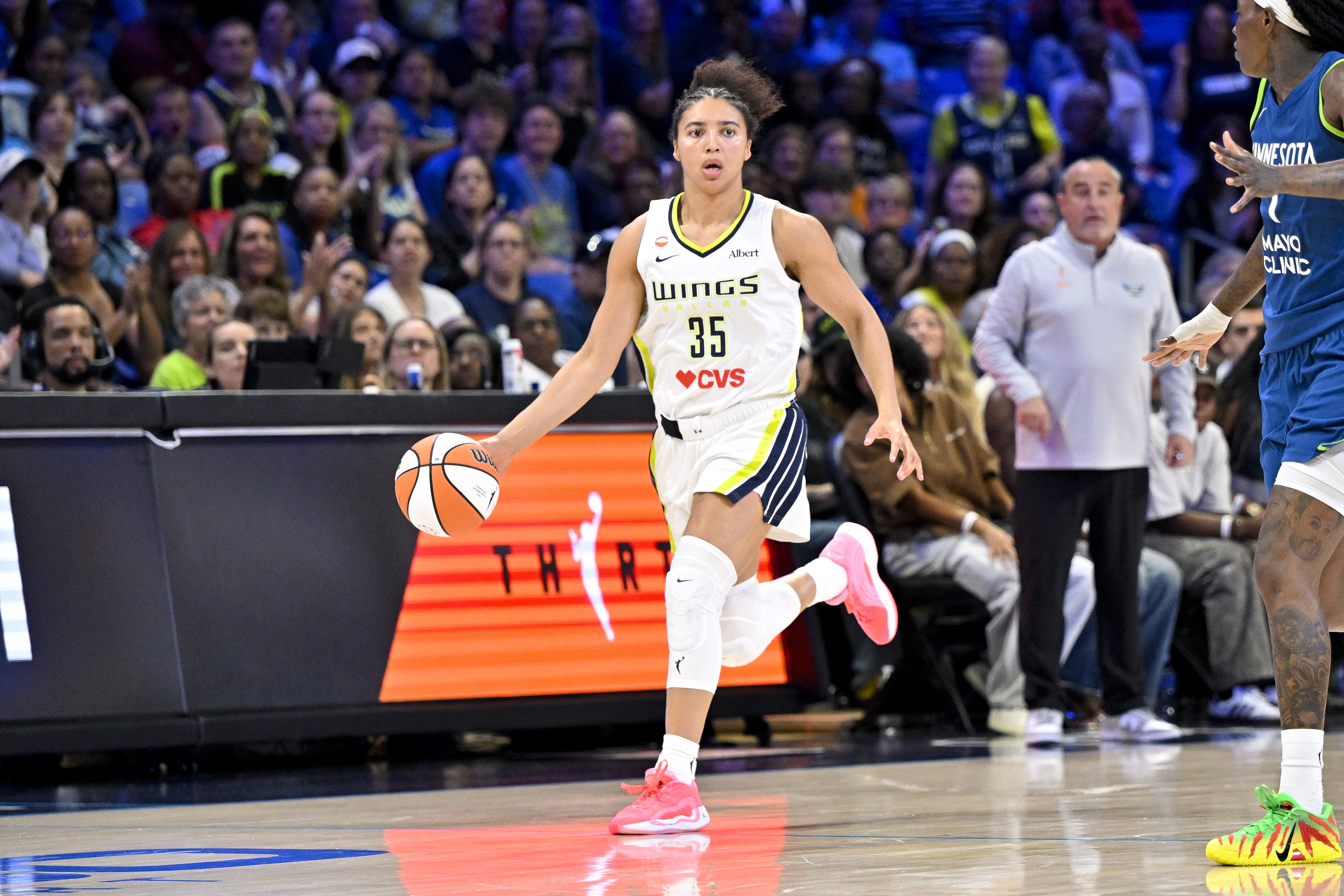 Dallas Wings guard Azzi Fudd (35) brings the ball up court as she is featured in our Mercury vs Wings prediction.