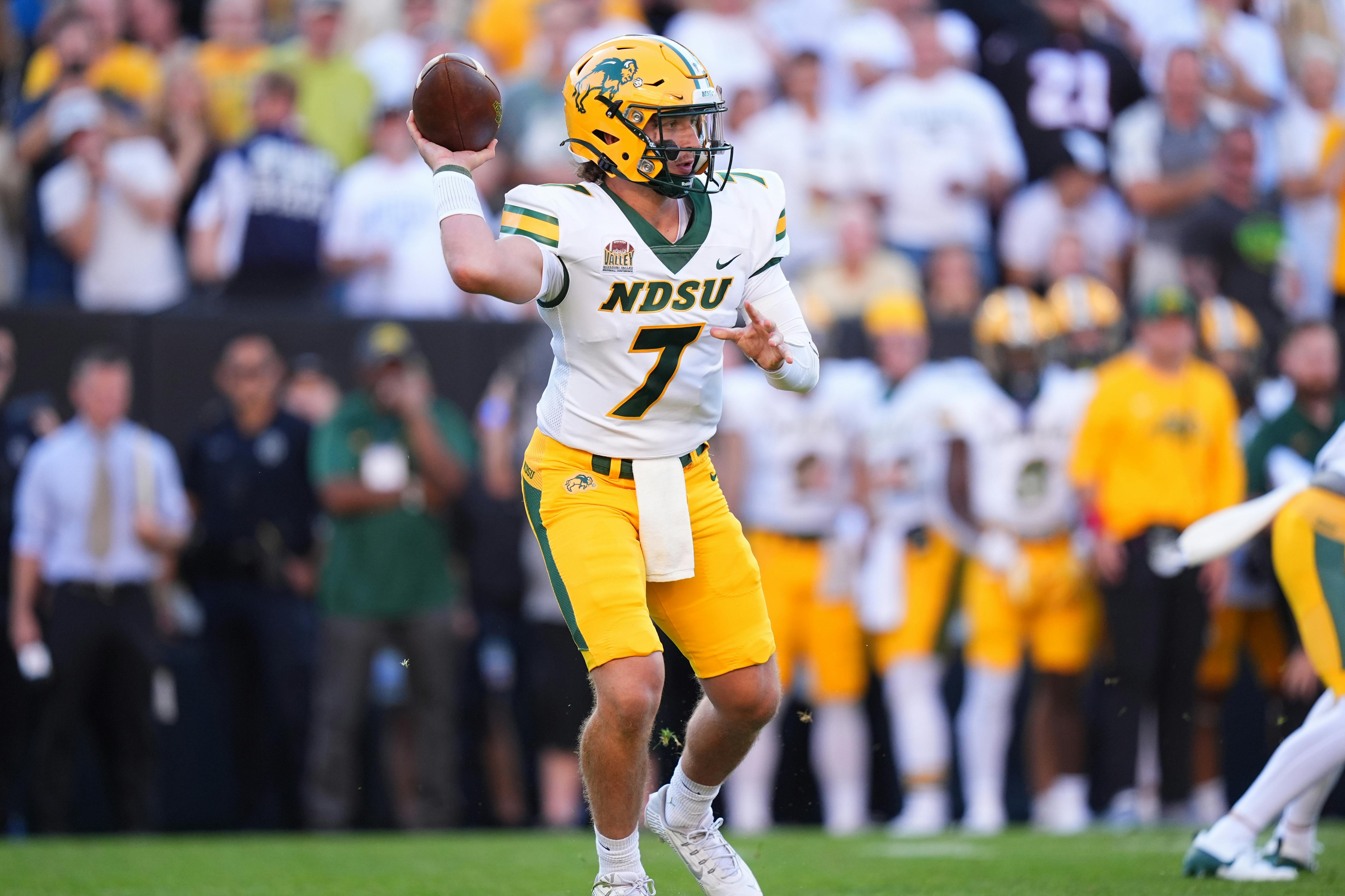 North Dakota State quarterback Cam Miller scrambles against Colorado. NDSU has the third-shortest FCS championship odds.