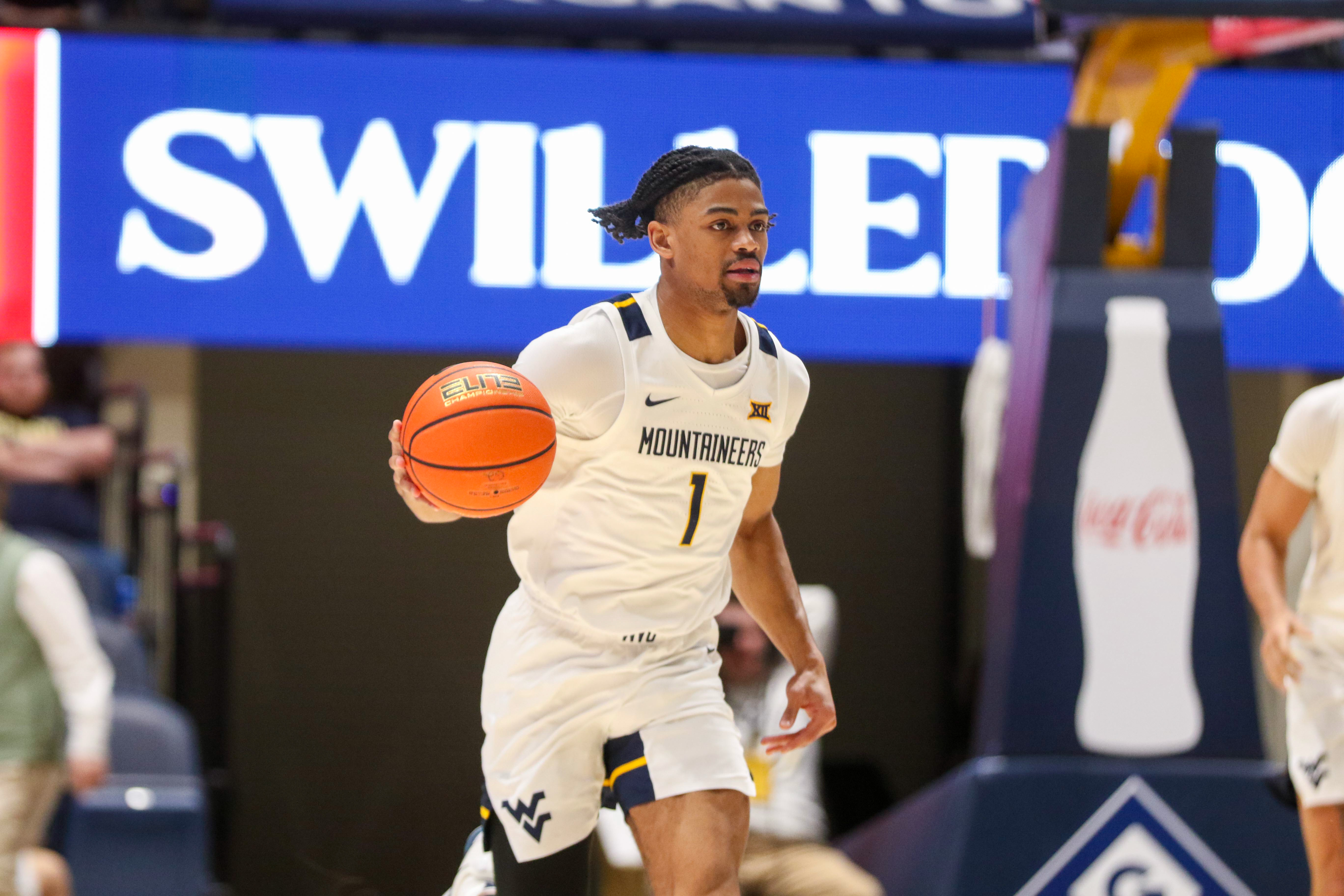 West Virginia's Jasper Floyd is key to our West Virginia vs. Creighton prediction for the College Basketball Crown semifinals.