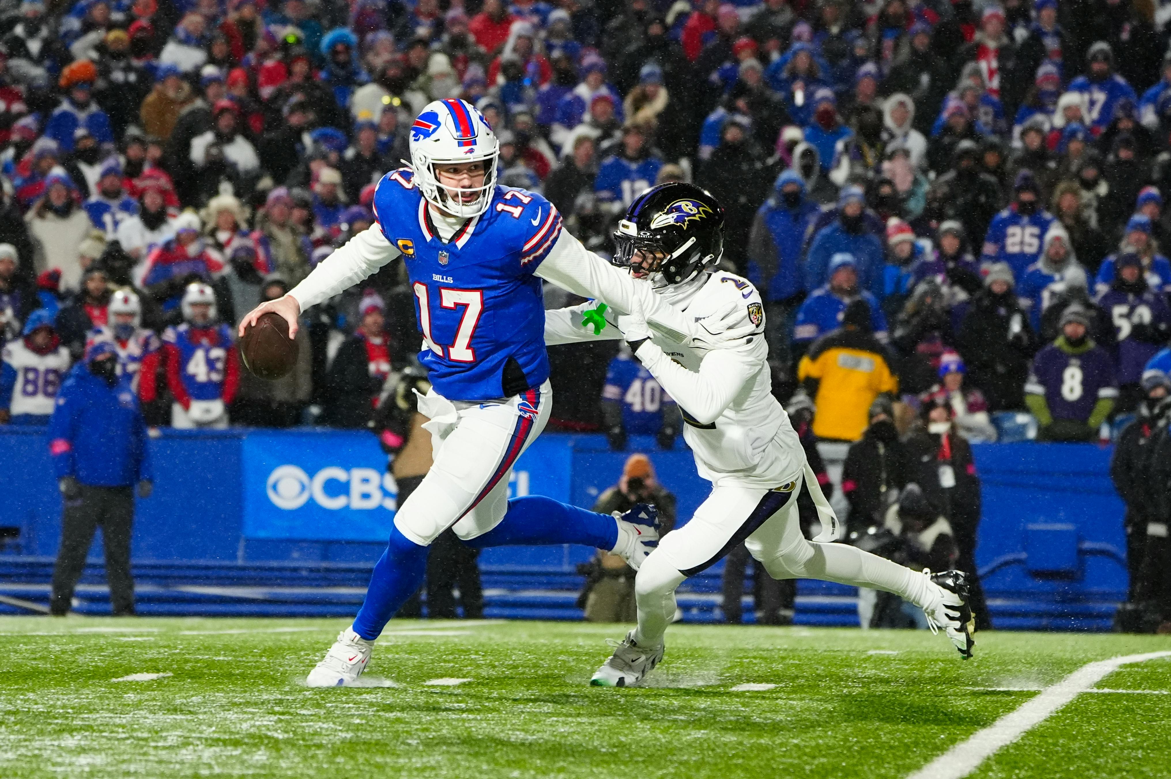 Pictured: Buffalo Bills quarterback Josh Allen avoids a tackle as we make our Super Bowl predictions and offer our pick to win Super Bowl 59.