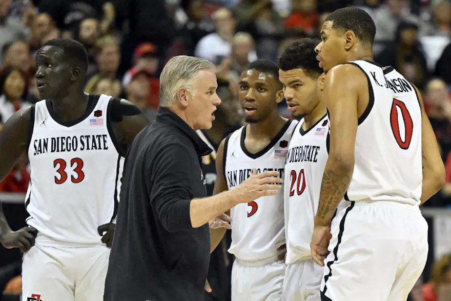 Head coach Brian Dutcher of the San Diego State Aztecs talks to his players during the Mountain West basketball tournament at the Thomas & Mack Center in Las Vegas, Nevada. Photo by David Becker/Getty Images via AFP.