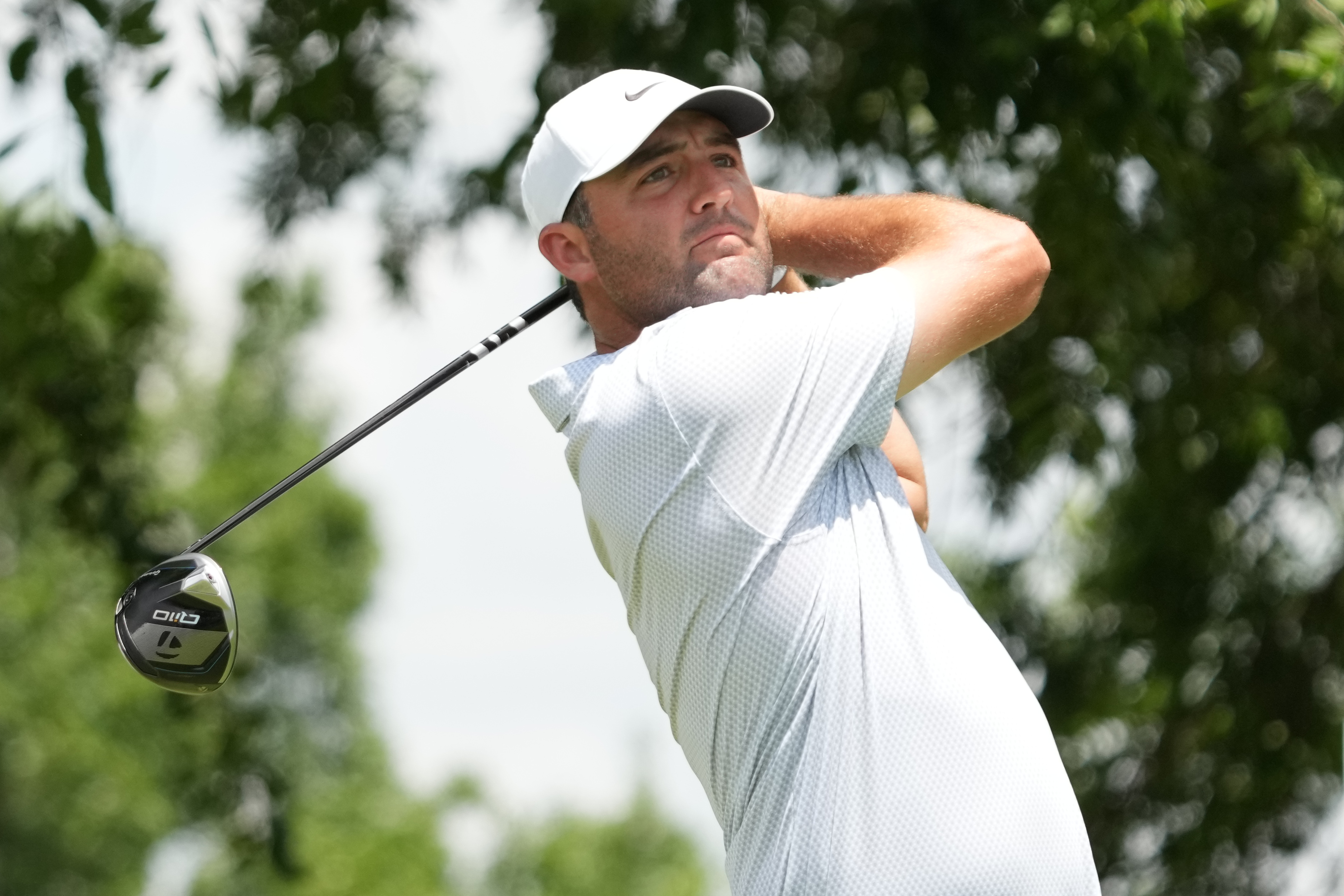 Scottie Scheffler plays his shot from the second tee
