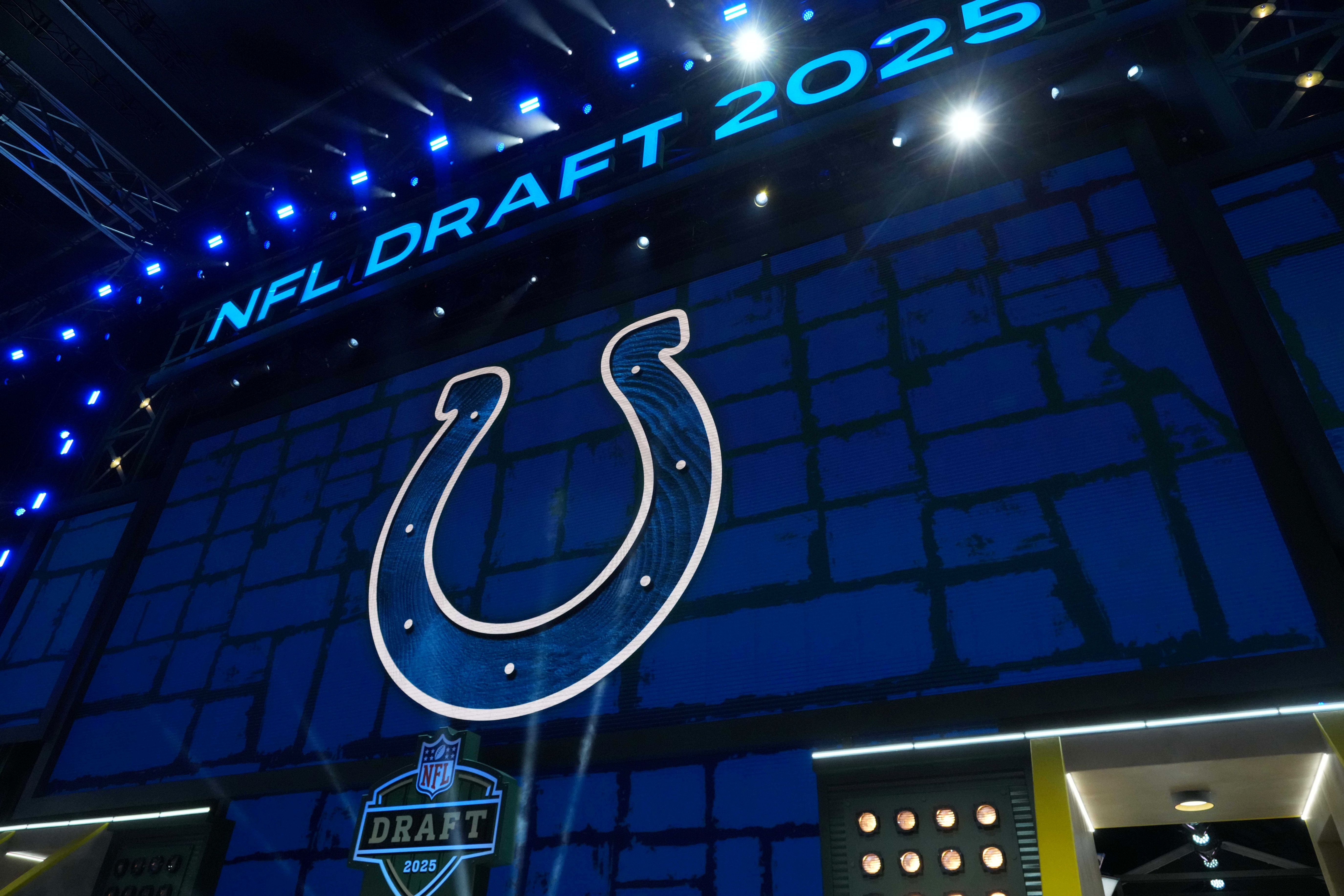 The Indianapolis Colts logo is projected on the video board during the NFL Draft at Lambeau Field.