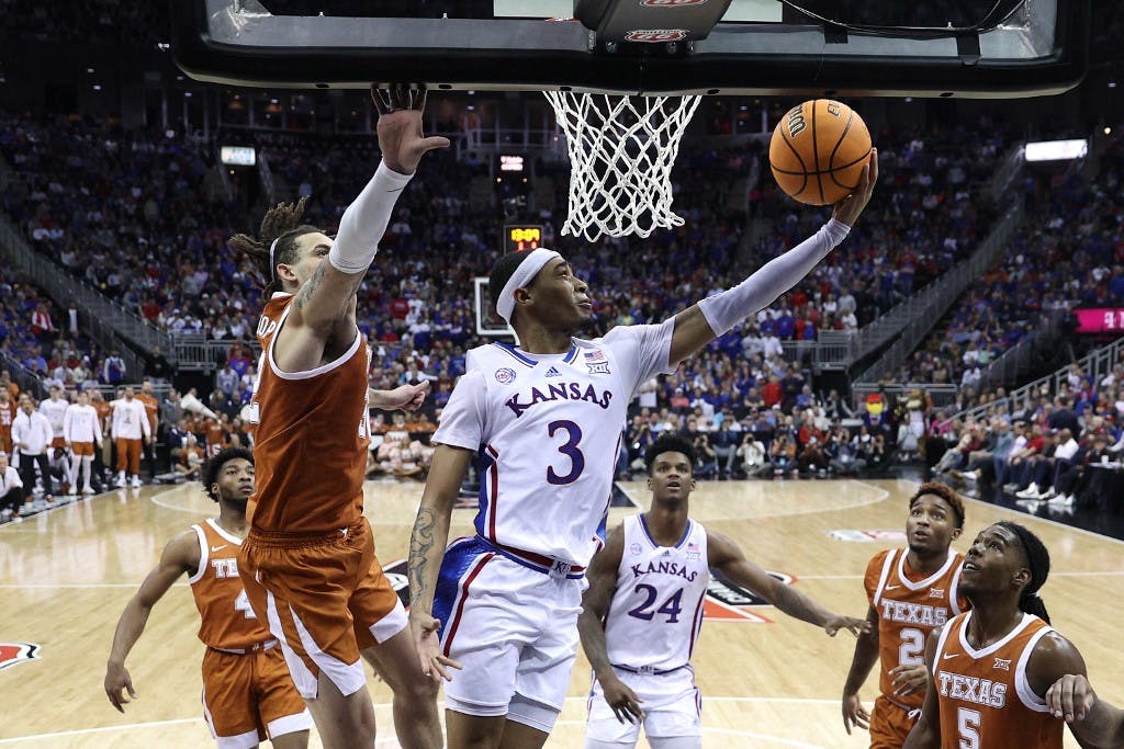 Dajuan Harris Jr. #3 of the Kansas Jayhawks shoots a layup as we look at the top March Madness betting trends.