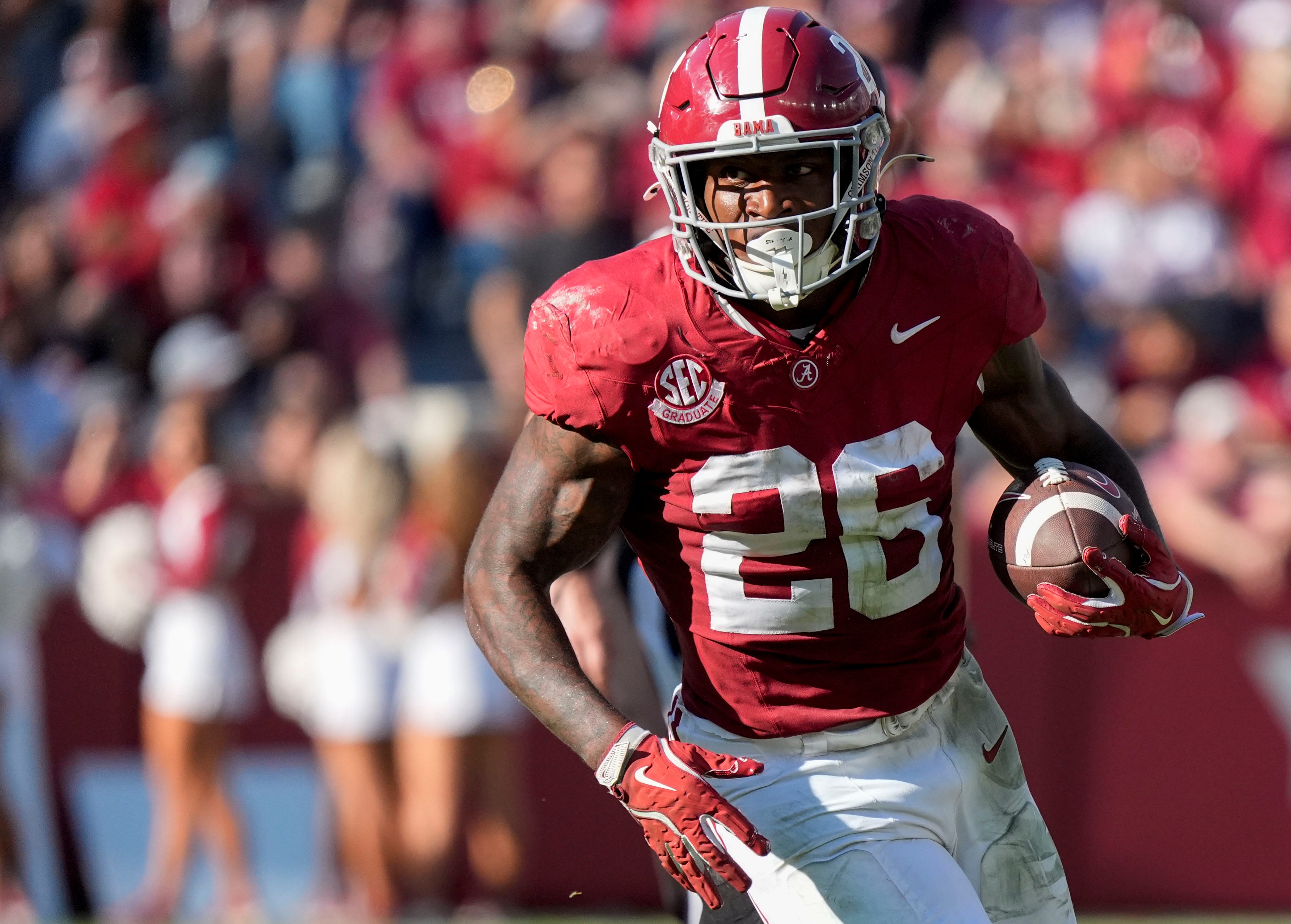 Alabama running back Jam Miller (26) runs the ball as we break down our Indiana vs. Alabama expert picks for the Rose Bowl.