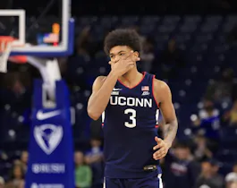 Jaylin Stewart #3 of the Connecticut Huskies reacts as we look at the latest 2024 March Madness odds ahead of the NCAA Tournament.