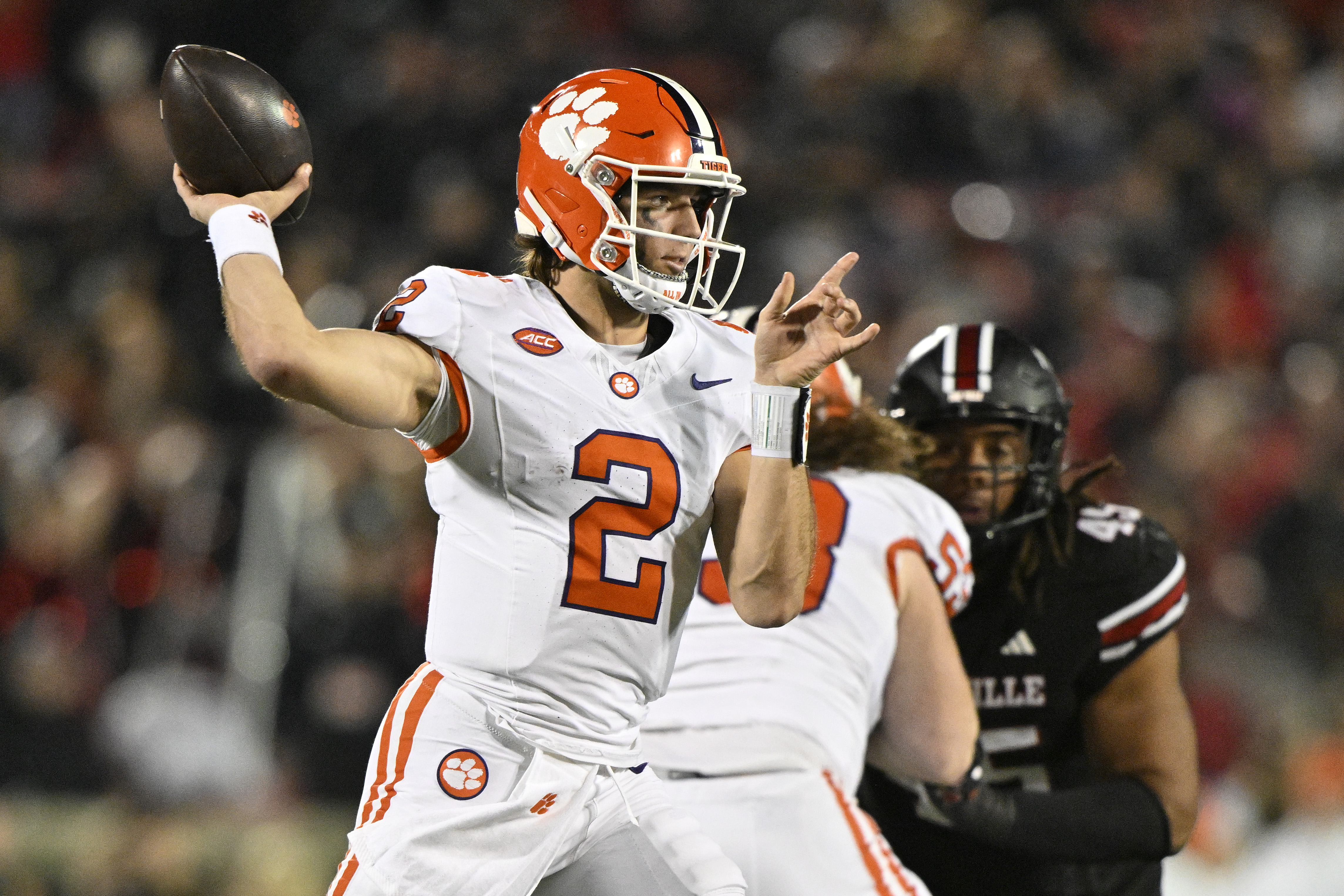 Clemson quarterback Cade Klubnik (2) looks to pass as we offer our Penn State vs. Clemson predictions today for the Pinstripe Bowl.