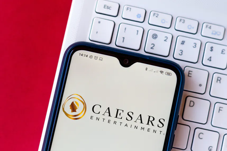 The Caesars Entertainment Corporation logo displayed on a smartphone