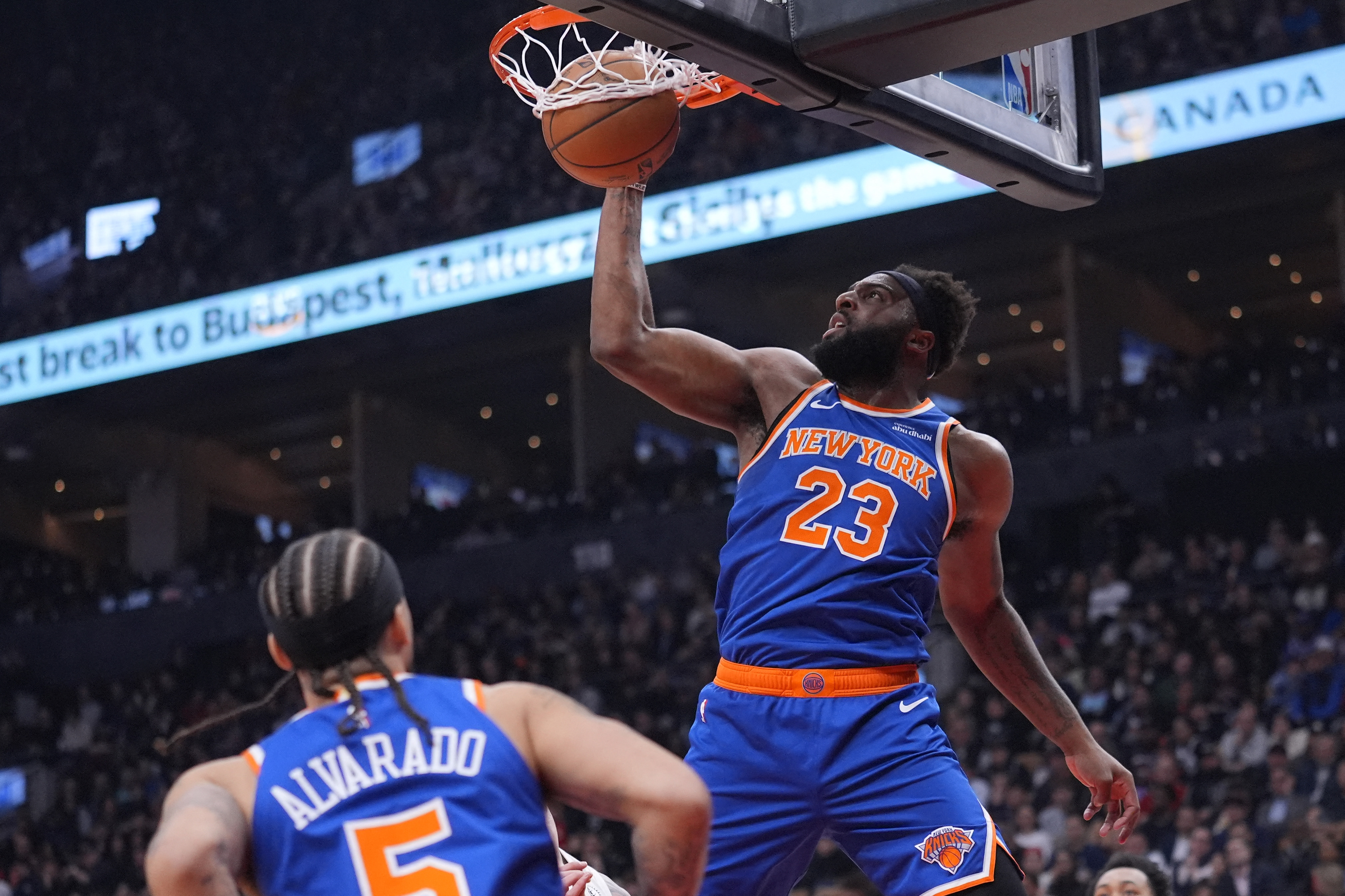 New York Knicks center Mitchell Robinson shoots as we make our best Warriors vs. Knicks player prop bets.