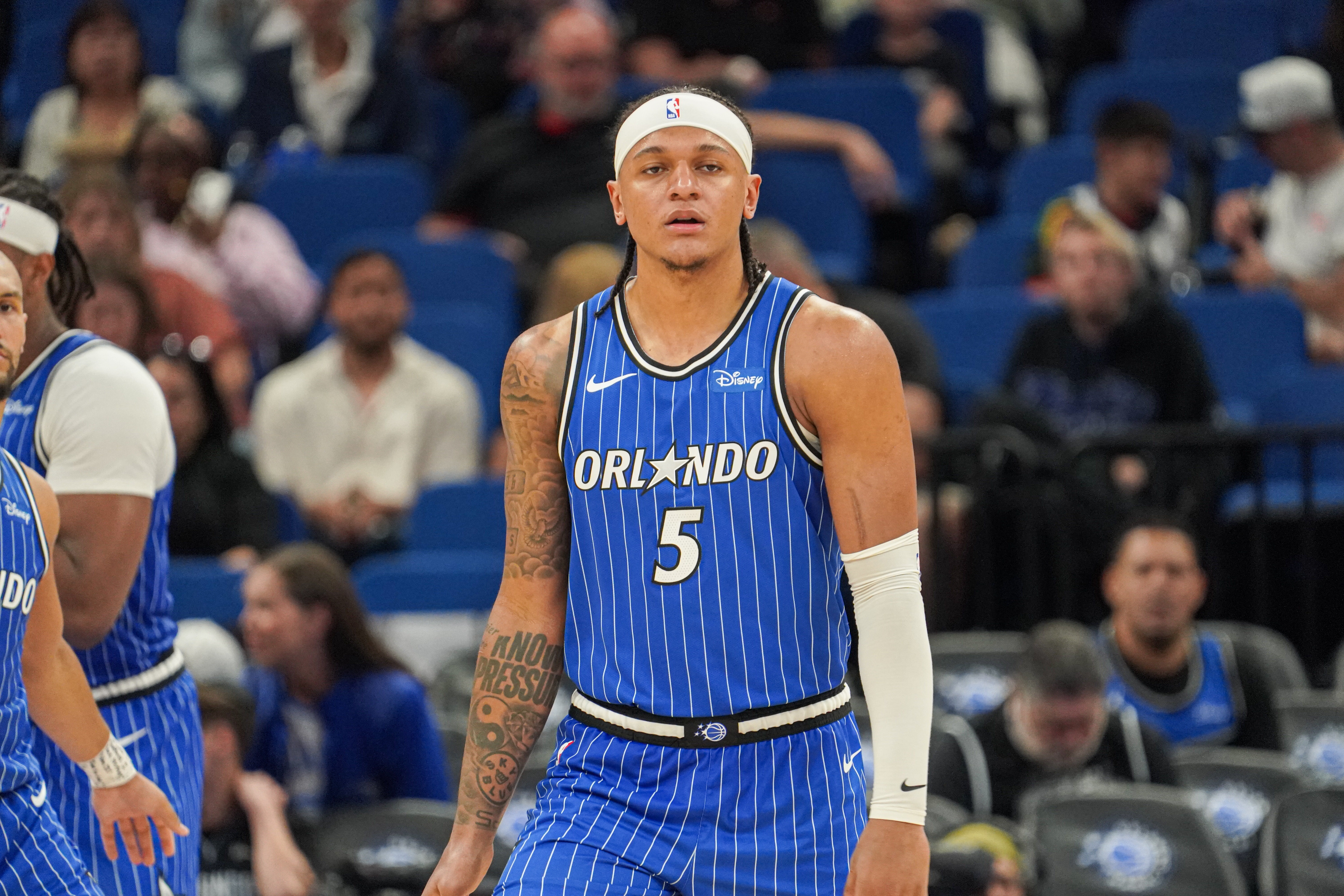 Orlando Magic forward Paolo Banchero (5), seen here looking on during a game, is featured in our Magic vs. Pistons player props for Game 1.