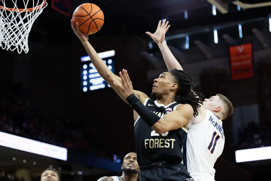 Hunter Sallis #23 of the Wake Forest Demon Deacons shoots past Isaac McKneely #11 of the Virginia Cavaliers as we look at our Notre Dame vs. Wake Forest prediction