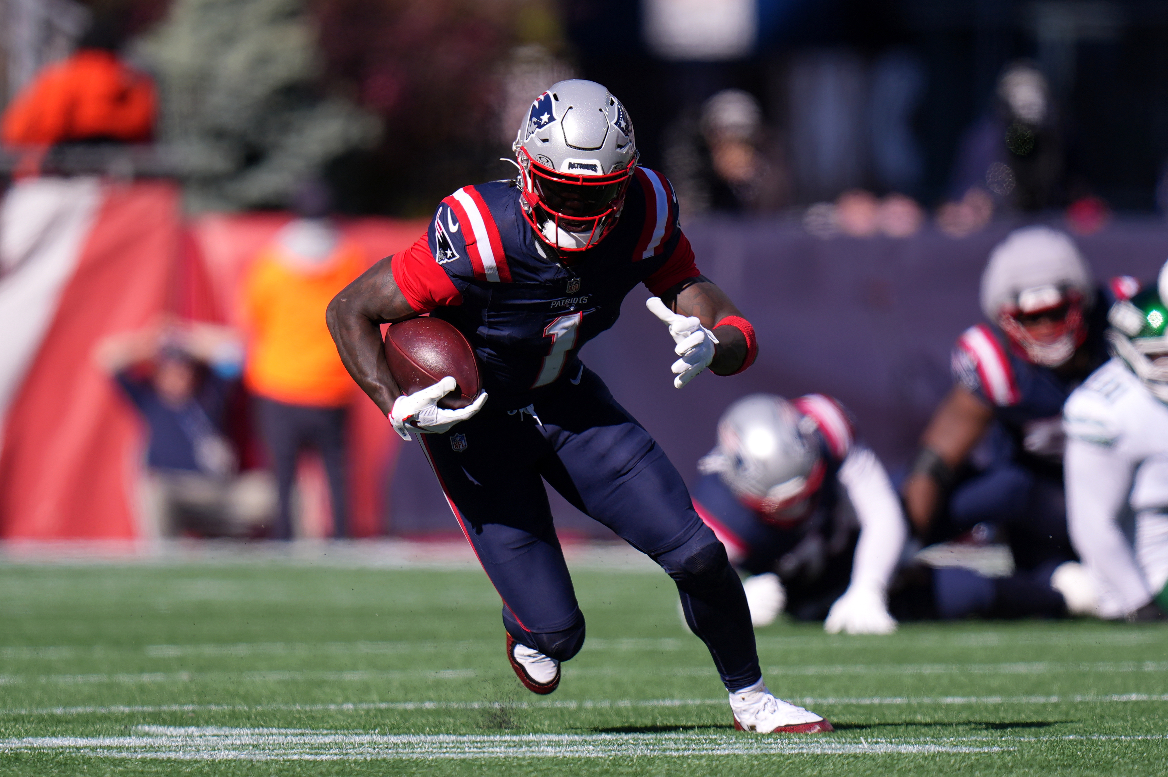New England Patriots wide receiver A.J. Brown (1) runs with the ball as he is featured in our Patriots vs. Bears touchdown scorer pick.