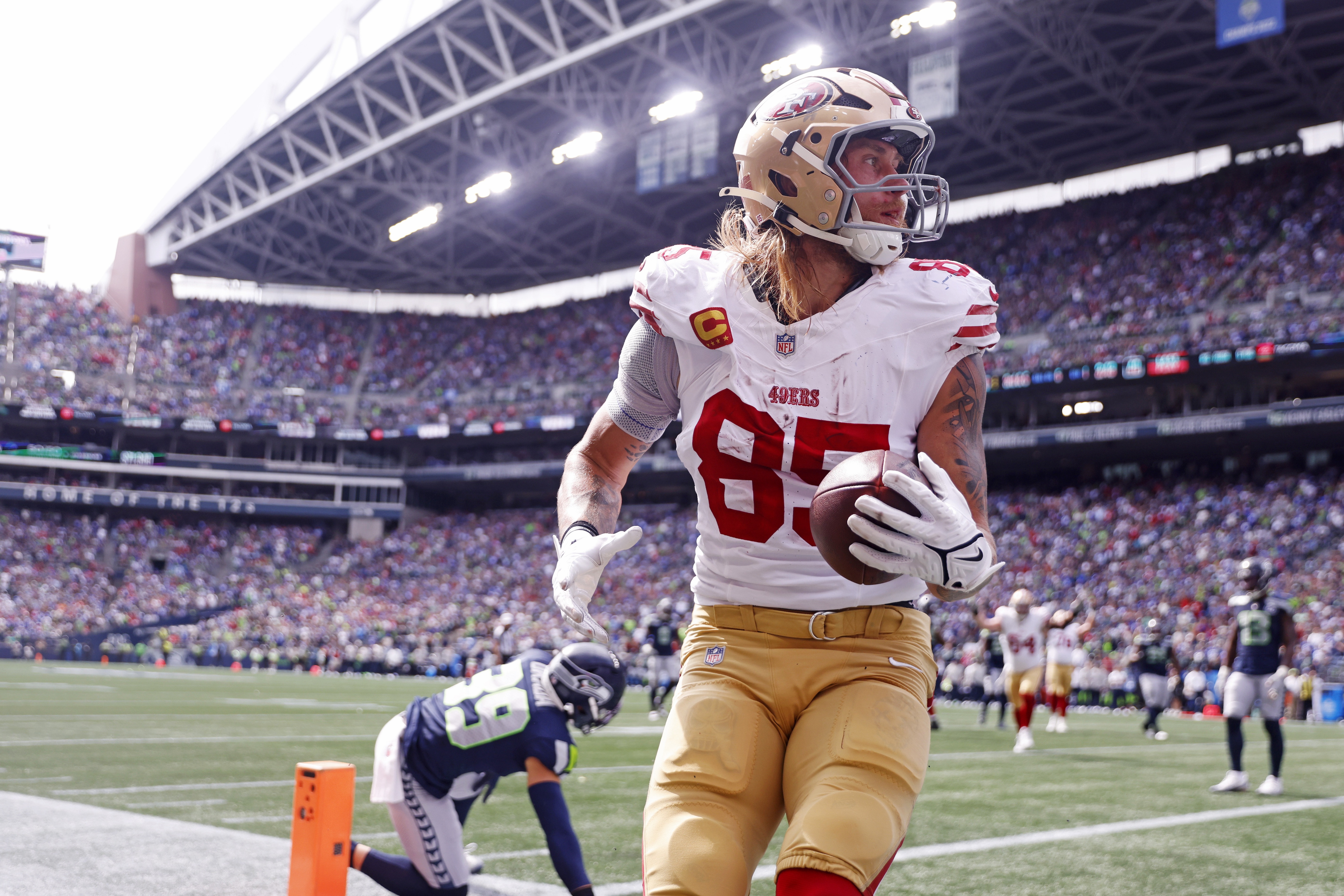 San Francisco 49ers tight end George Kittle (85) celebrates after scoring a touchdown as we provide our 49ers vs. Seahawks prediction.