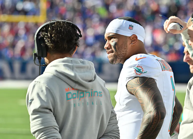 Miami Dolphins quarterback Tua Tagovailoa on the sidelines with head coach Mike McDaniel as we make our best Tua Tagovailoa MNF player prop bets.