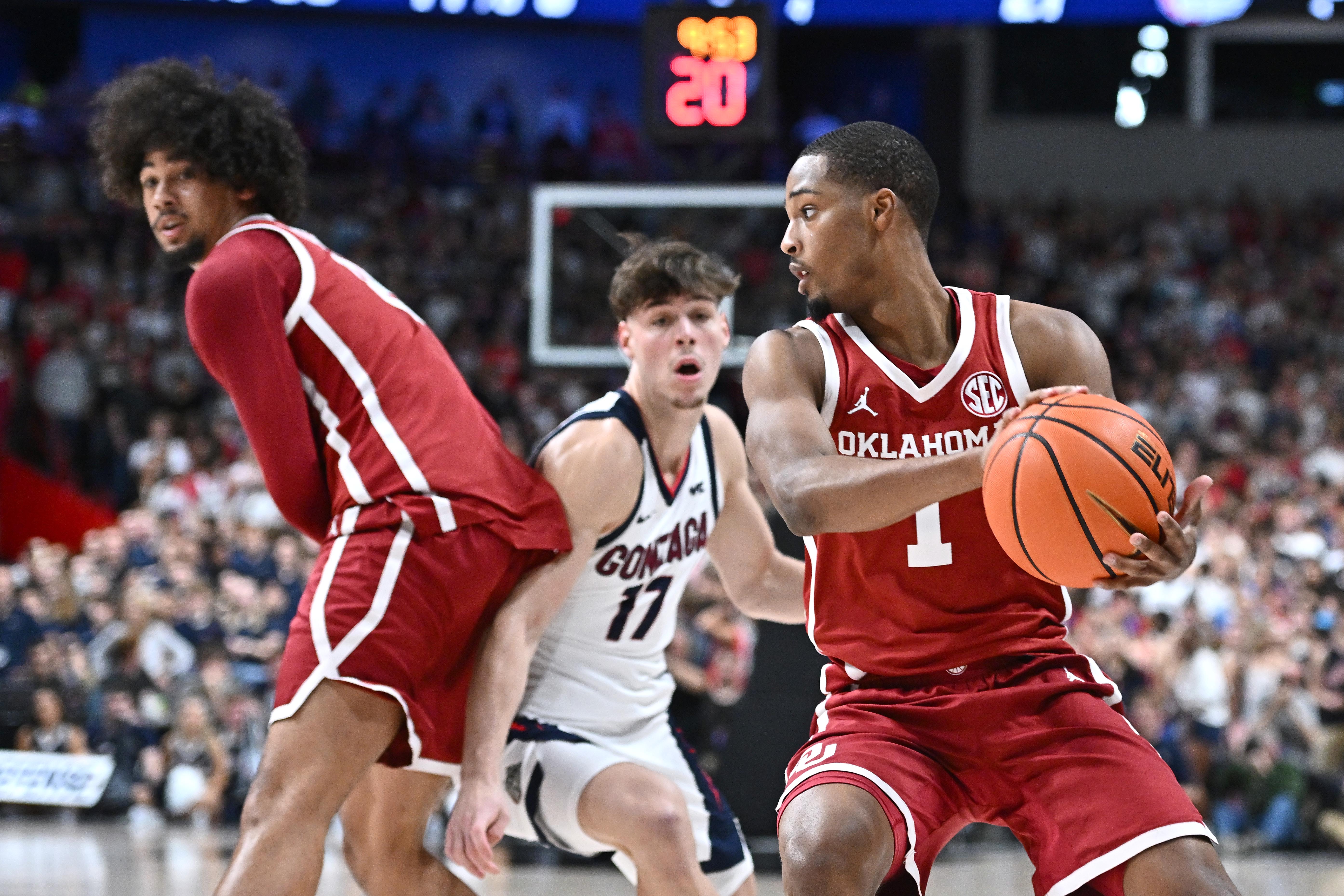 Oklahoma guard Xzayvier Brown (1) controls the ball as we offer our Oklahoma vs. Marquette prediction