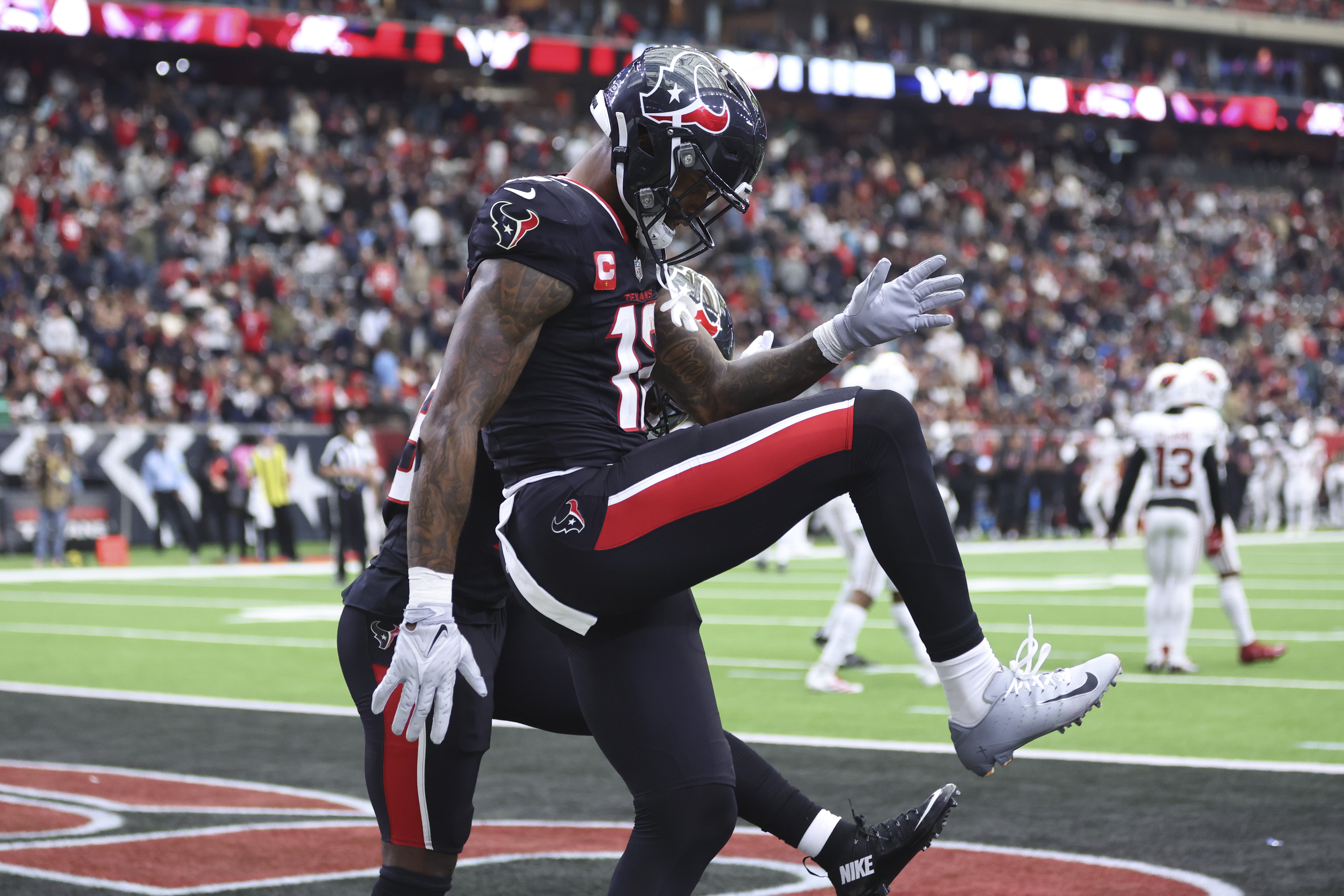 Houston Texans wide receiver Nico Collins celebrates after scoring a touchdown as we make our NFL best bets for the Wild Card Round. 