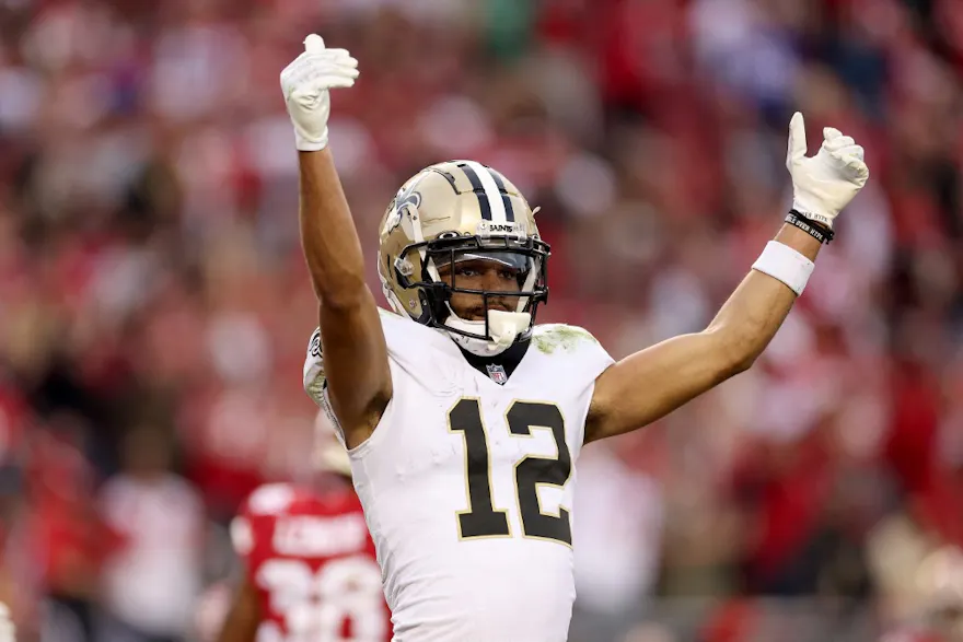 Chris Olave #12 of the New Orleans Saints reacts on the field as we look at our NFC South betting preview.