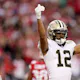 Chris Olave #12 of the New Orleans Saints reacts on the field as we look at our NFC South betting preview.