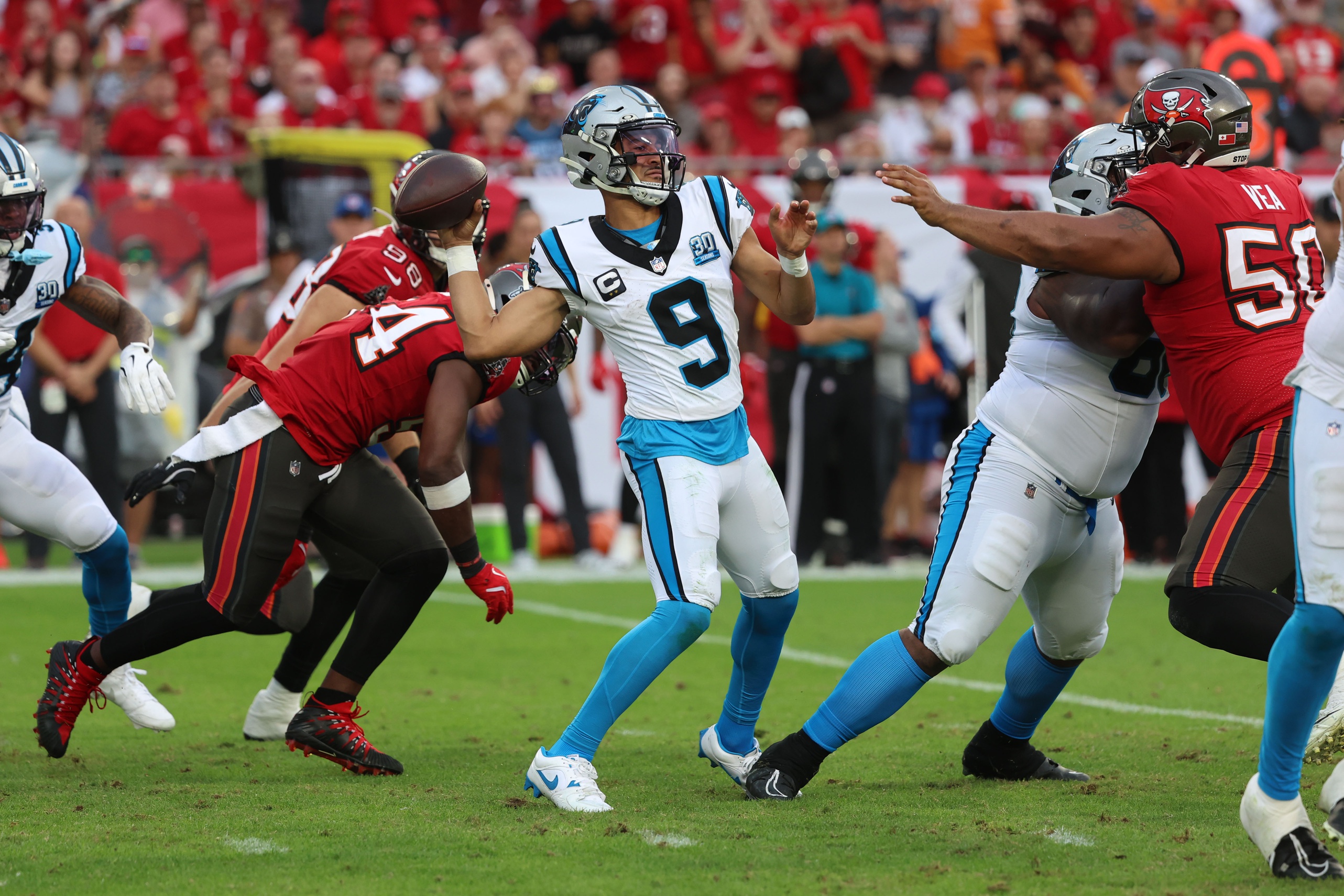 Bryce Young throws the ball as we offer our Panthers vs. Buccaneers predictions and opening odds. 